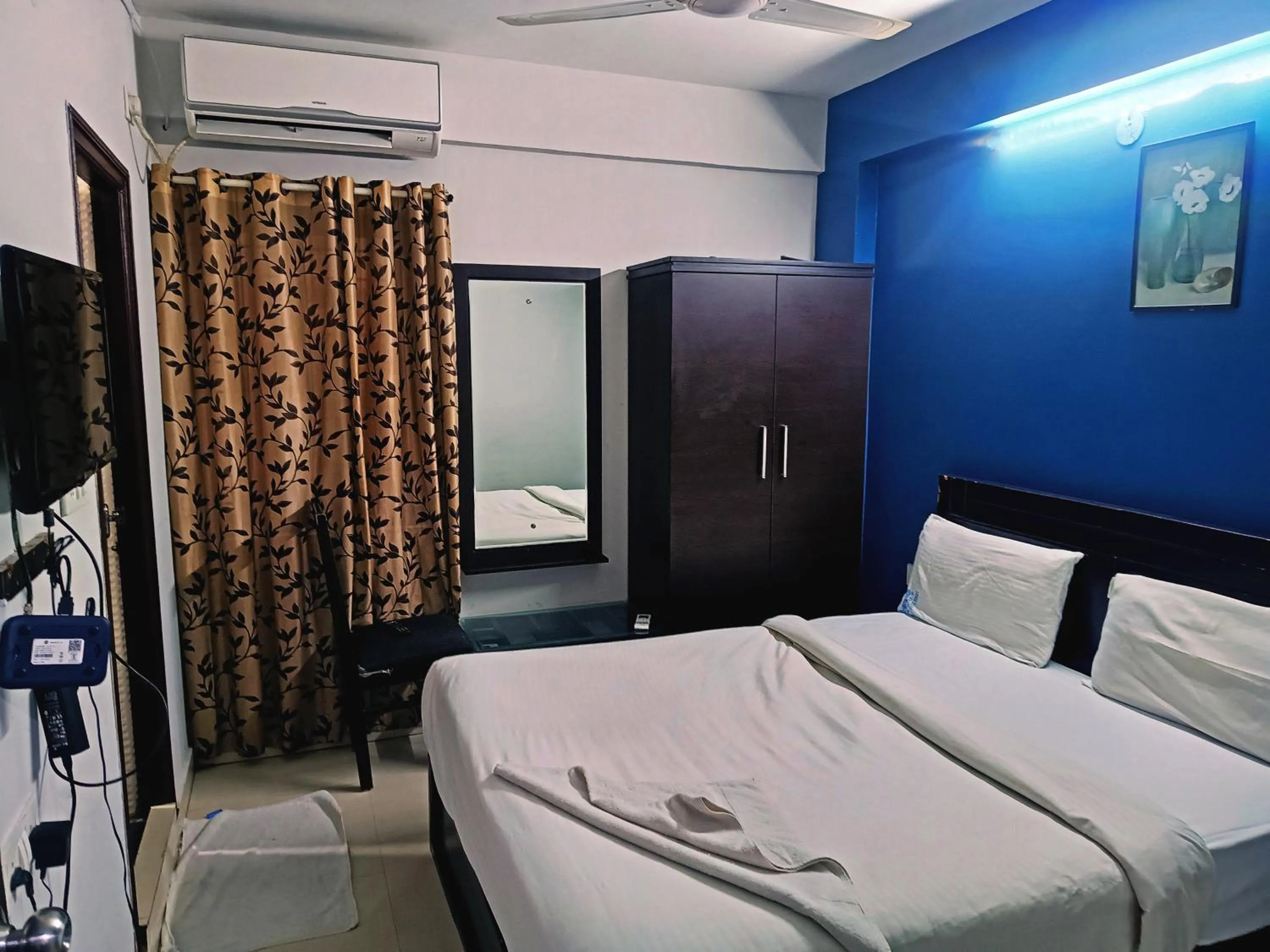 Bedroom in Delta Inn Madiwala