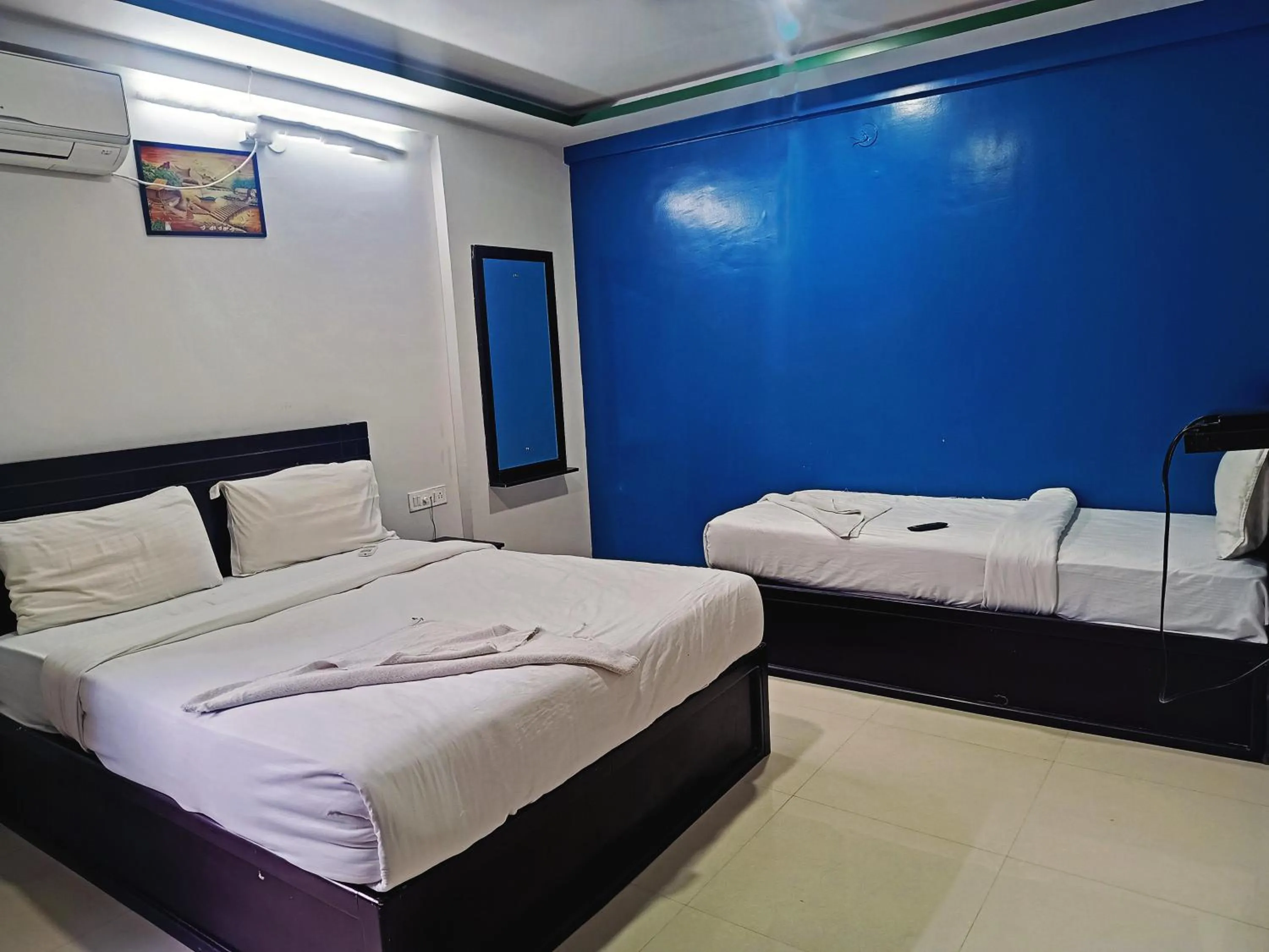 Bedroom in Delta Inn Madiwala