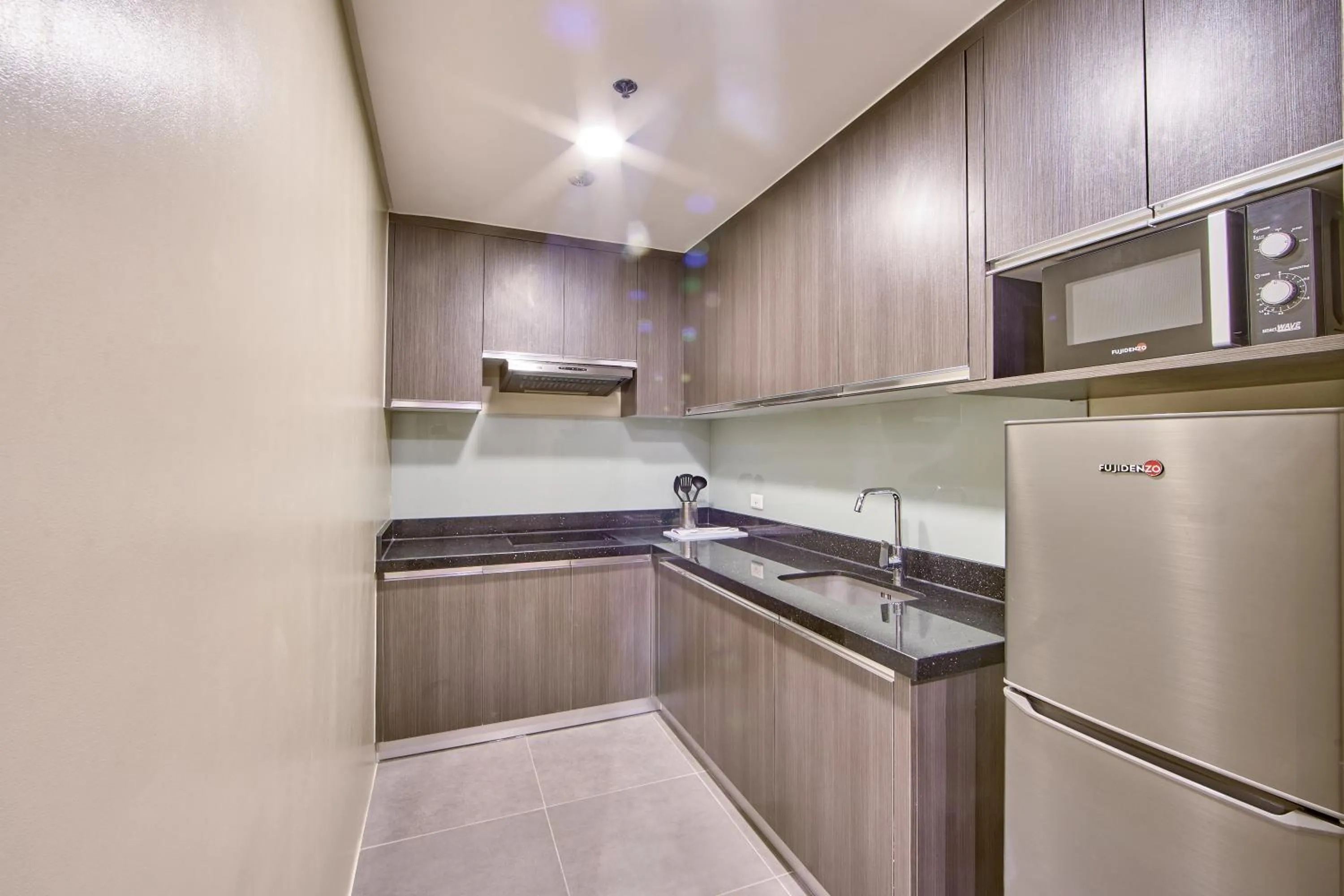 Kitchen or kitchenette in The Connor Serviced Residences Managed by HII
