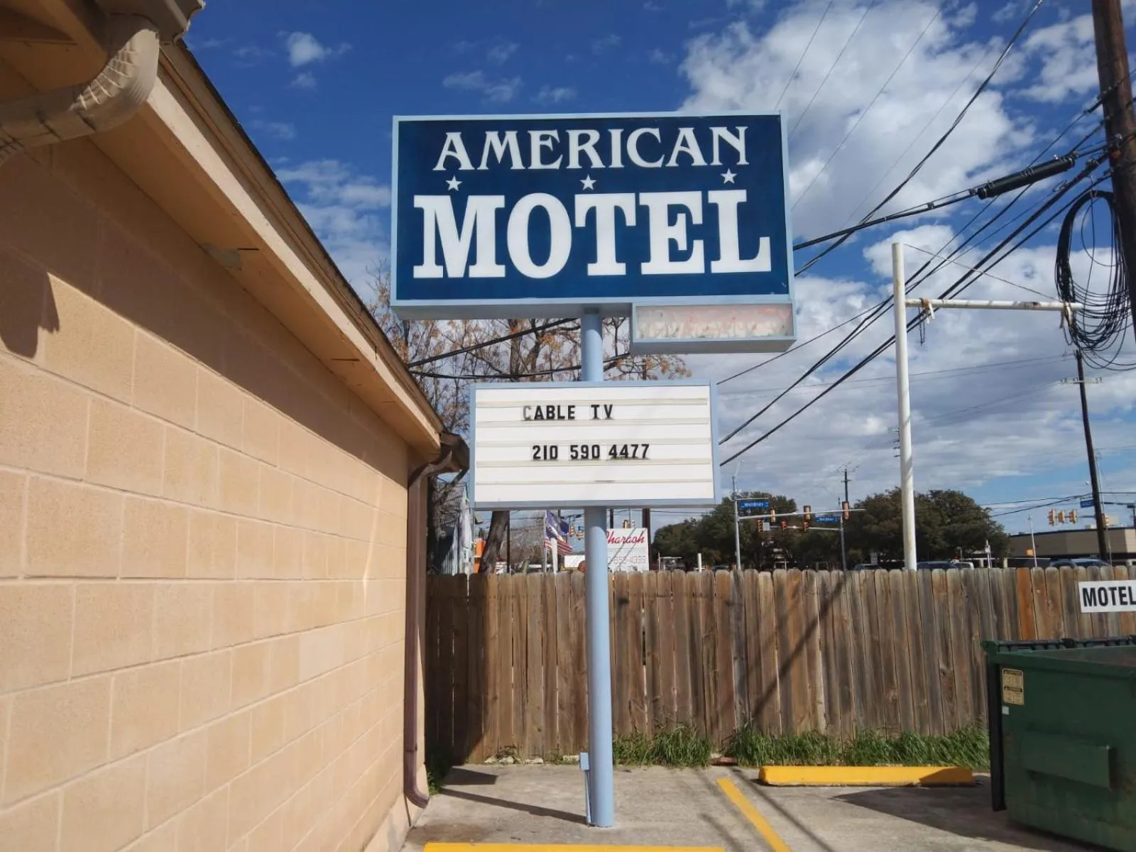 Property logo or sign in American Motel