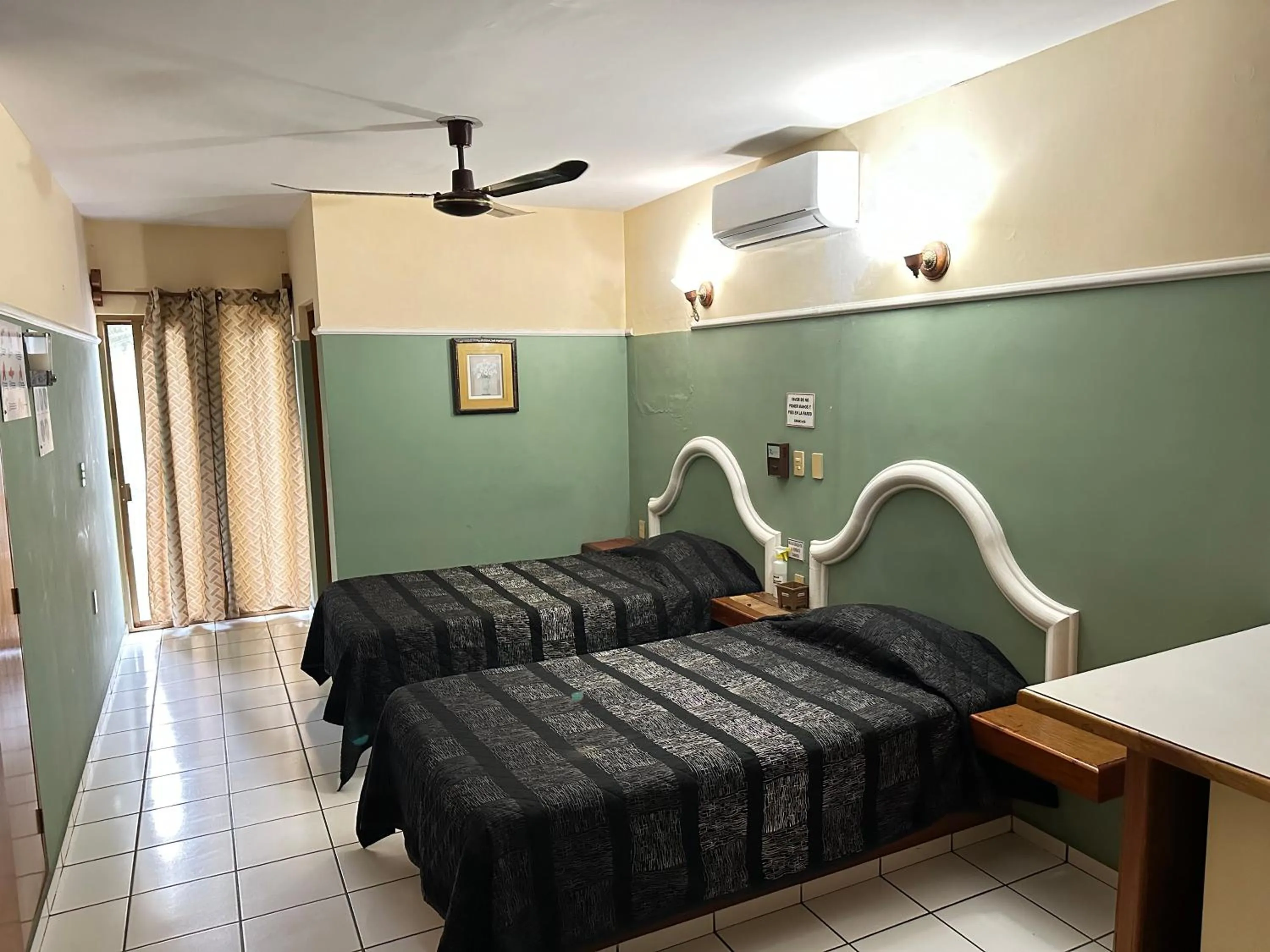 Bed in Blue Pacific Suites