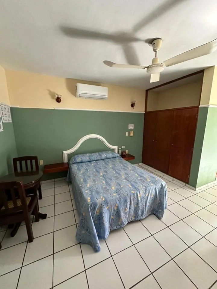 Bed in Blue Pacific Suites