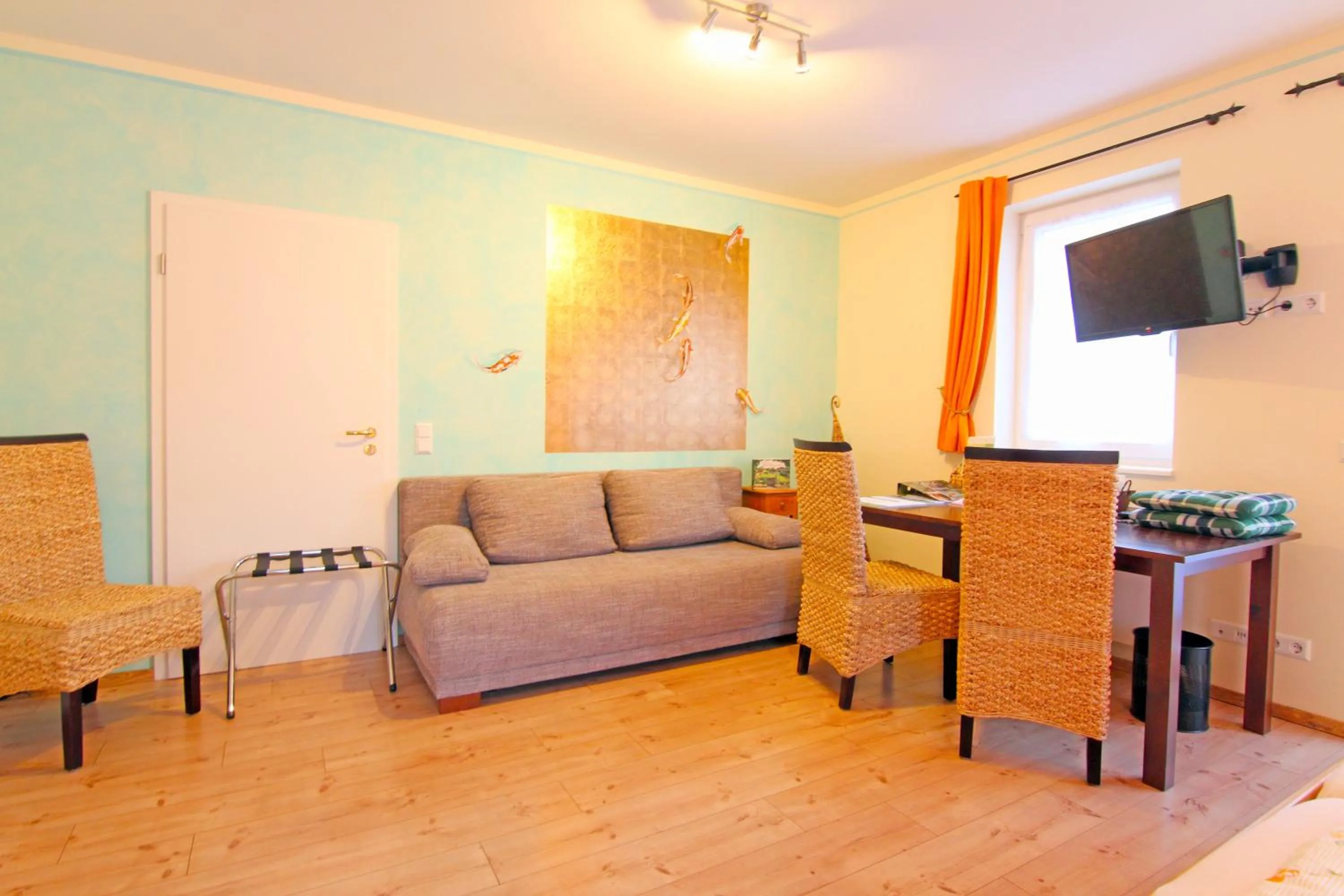 Communal lounge/ TV room in SCHUSTERjunge Aparthotel