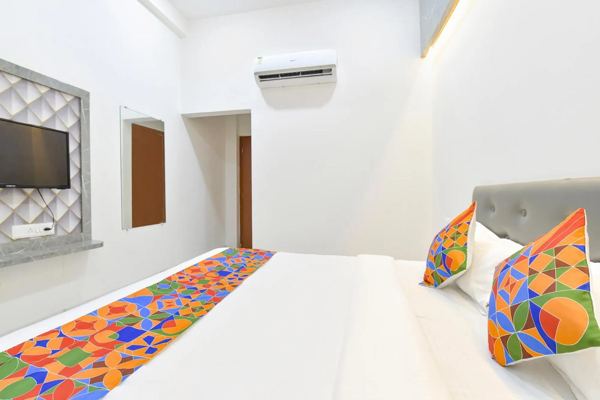 Bed in FabHotel Grand Embassy