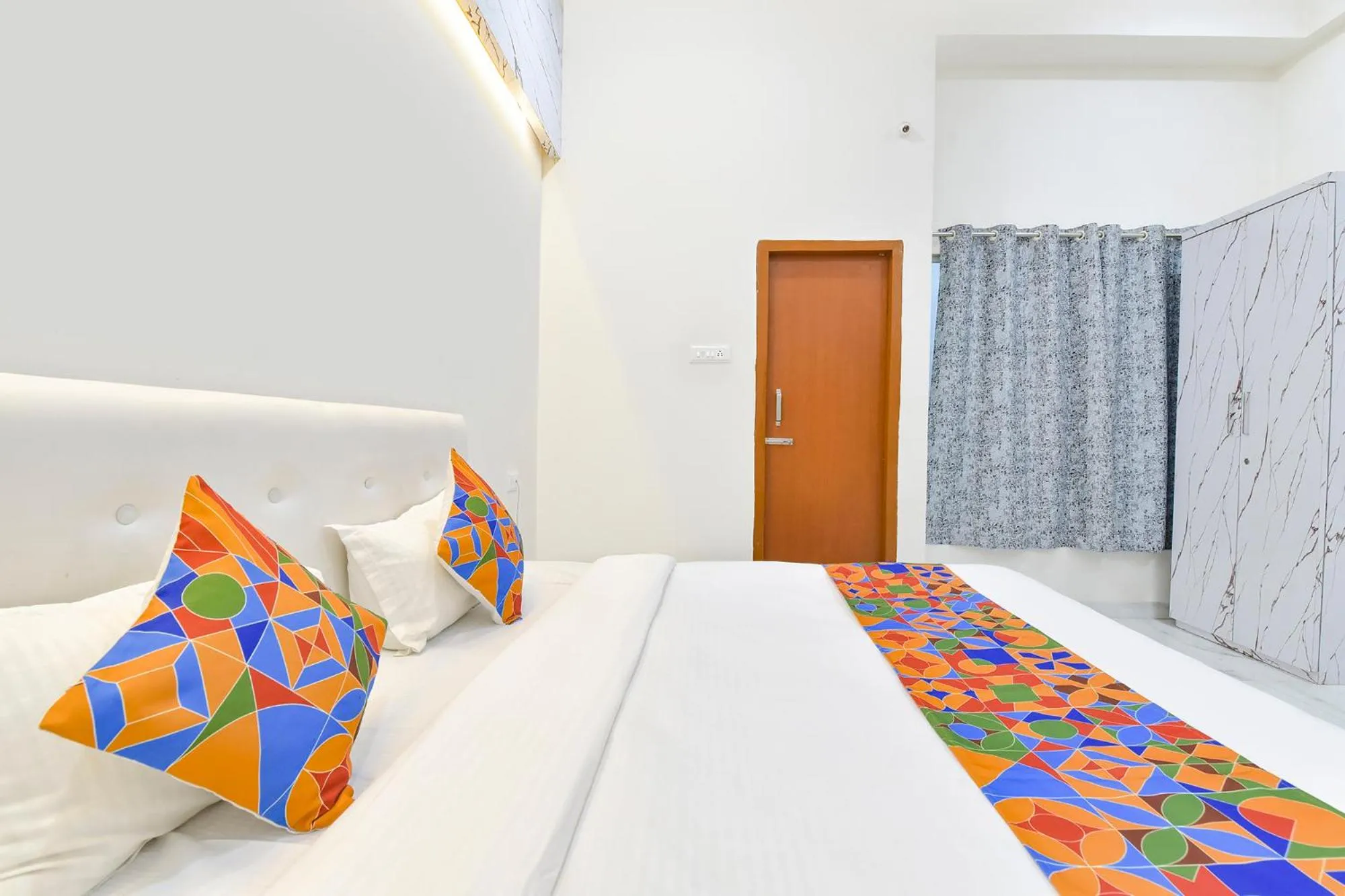 Bed in FabHotel Grand Embassy