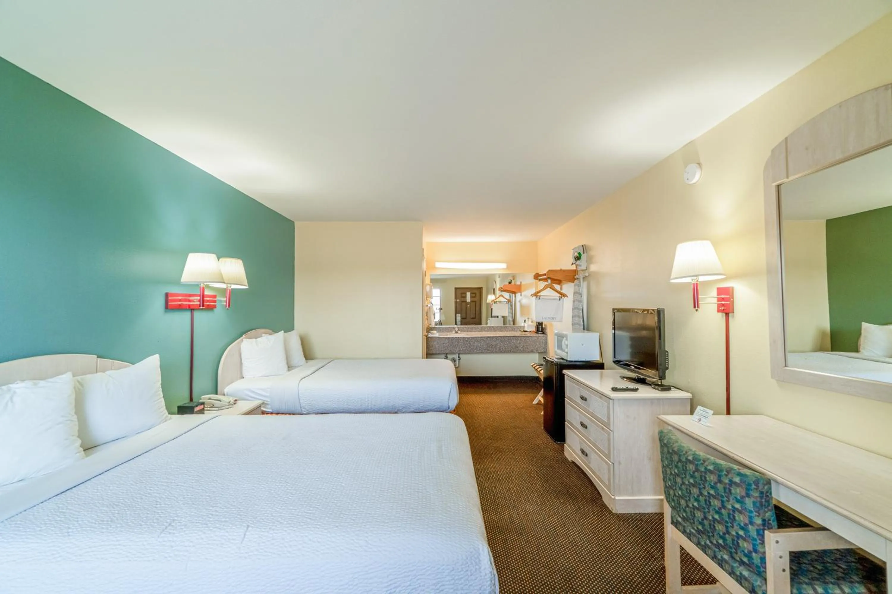 Bedroom, Bed in Shale Inn Andrews by OYO