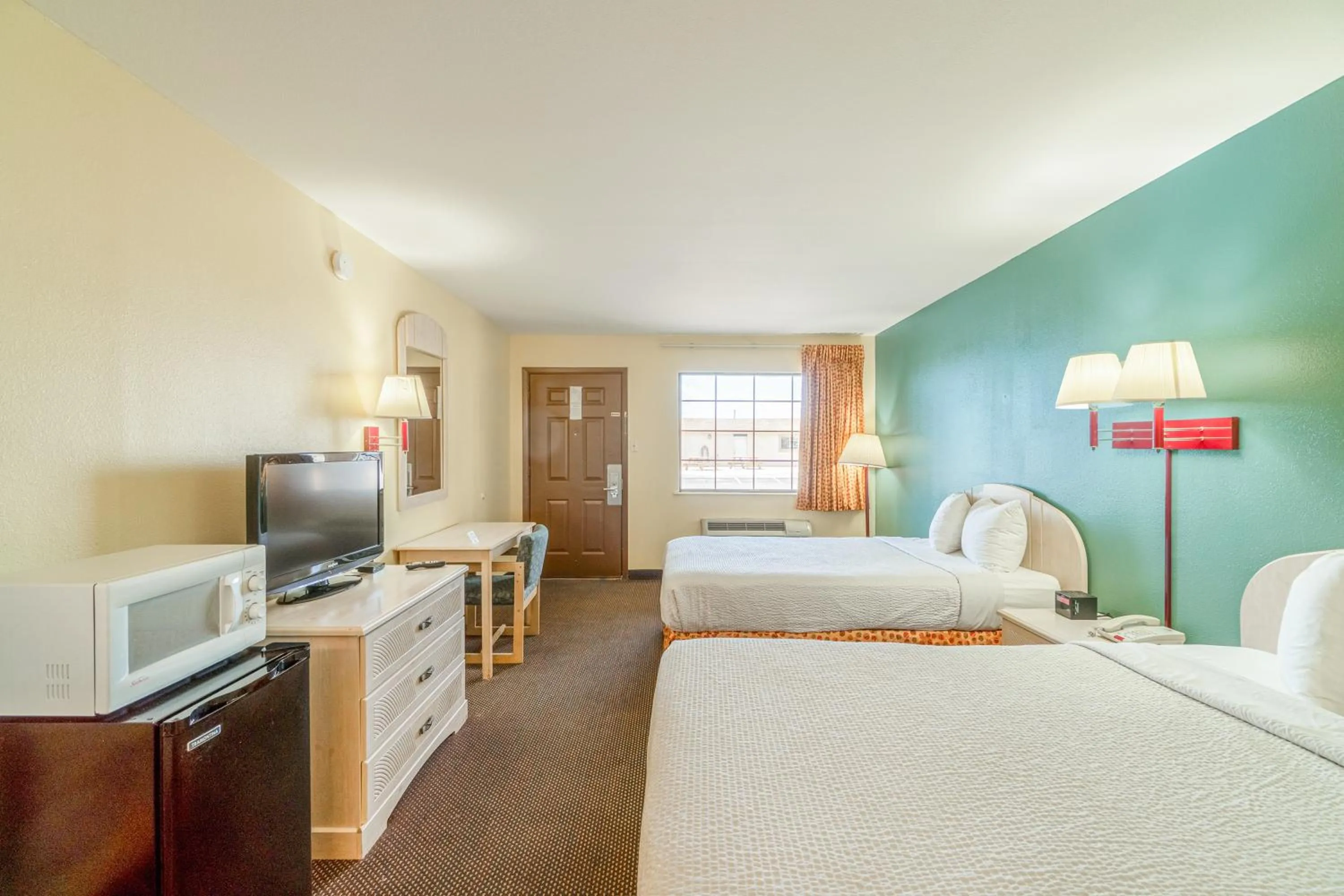 Bedroom, Bed in Shale Inn Andrews by OYO