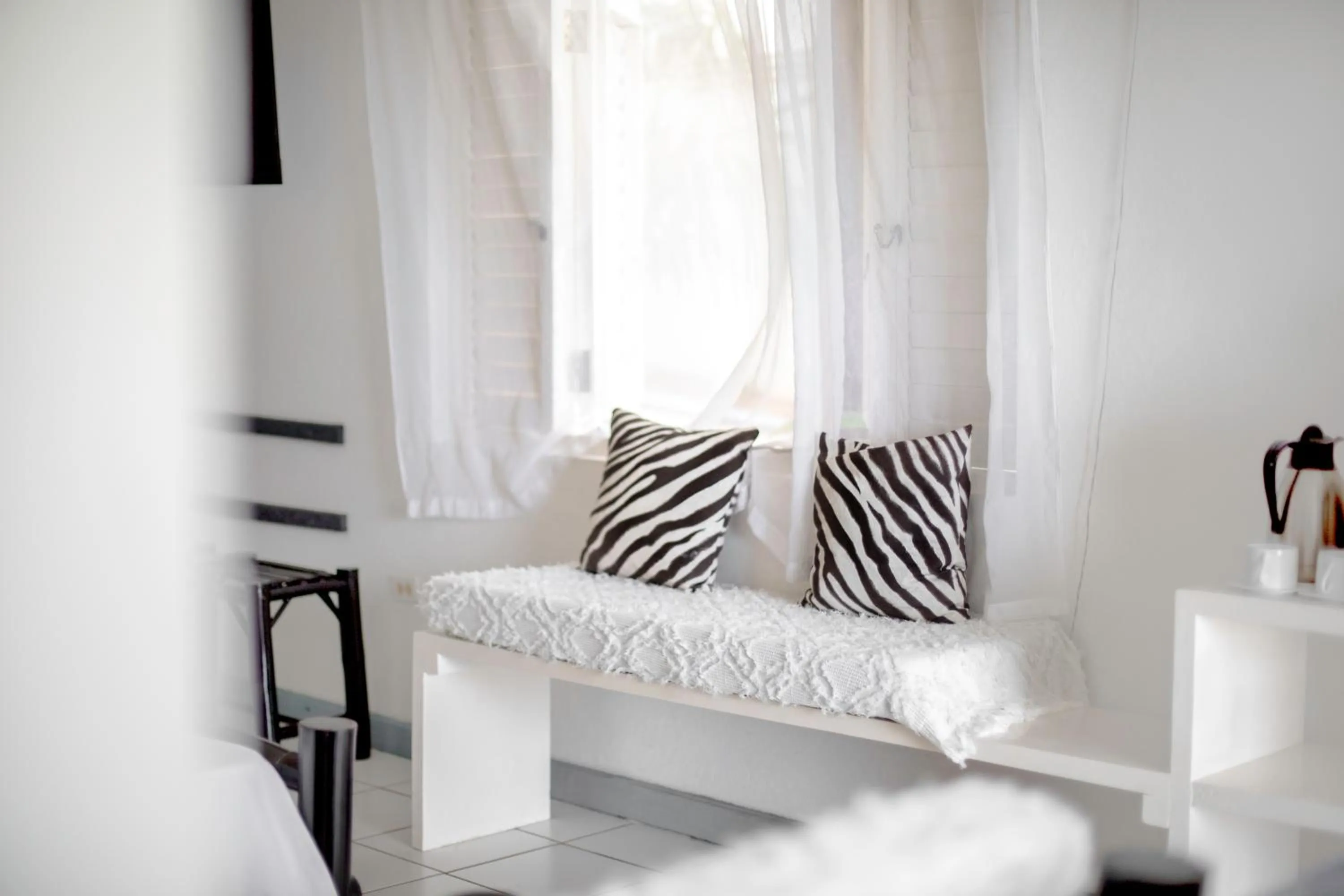 Seating area, Bed in LF Jungle Retreat