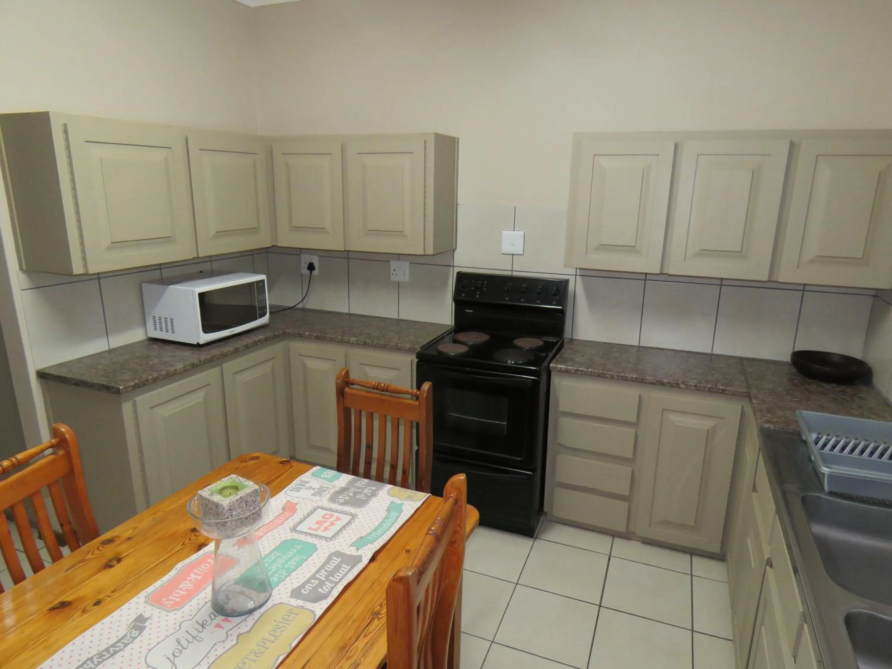 Kitchen or kitchenette in Sandy's Place