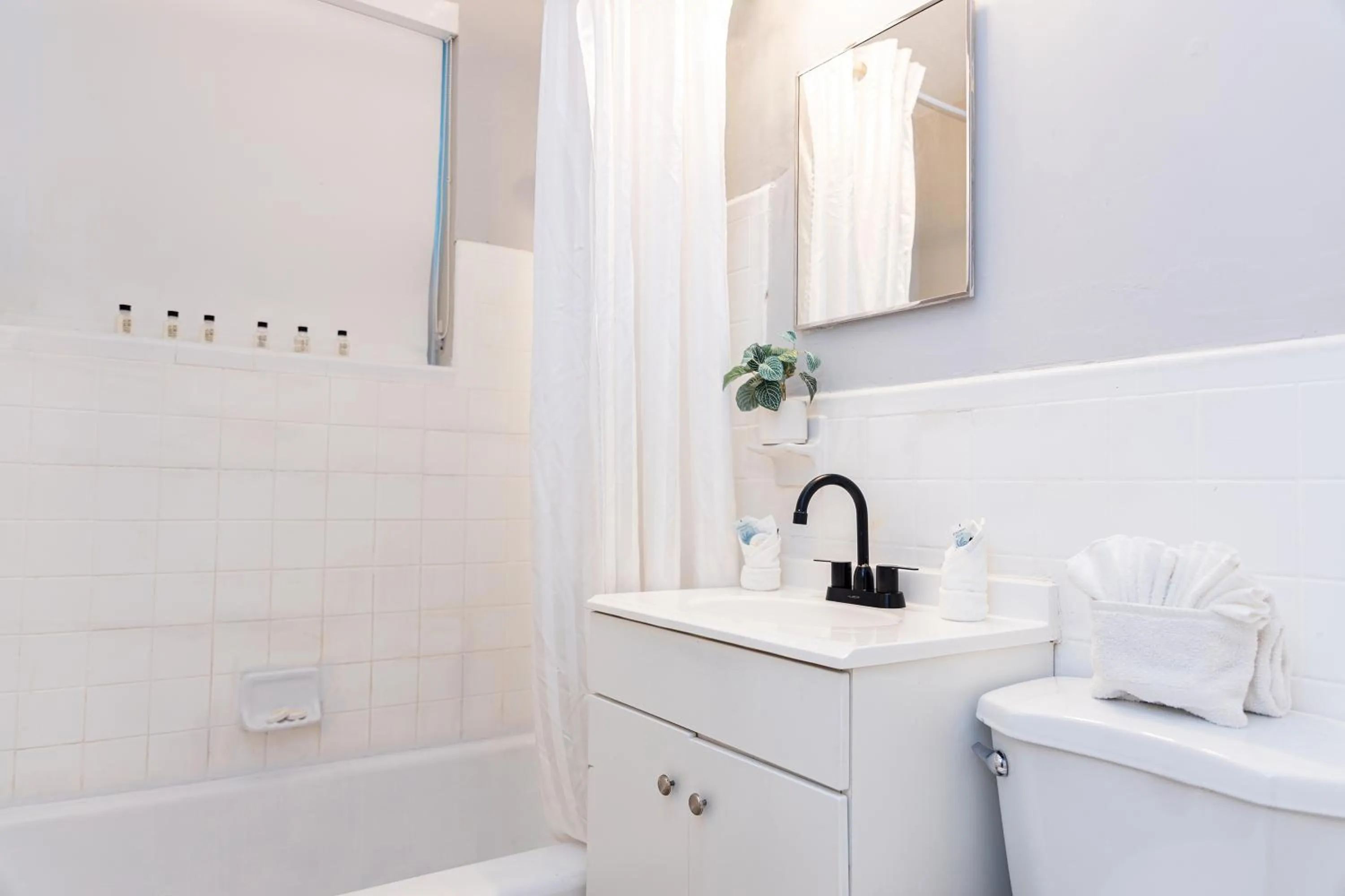 Bathroom in Beachside All Suites Hotel