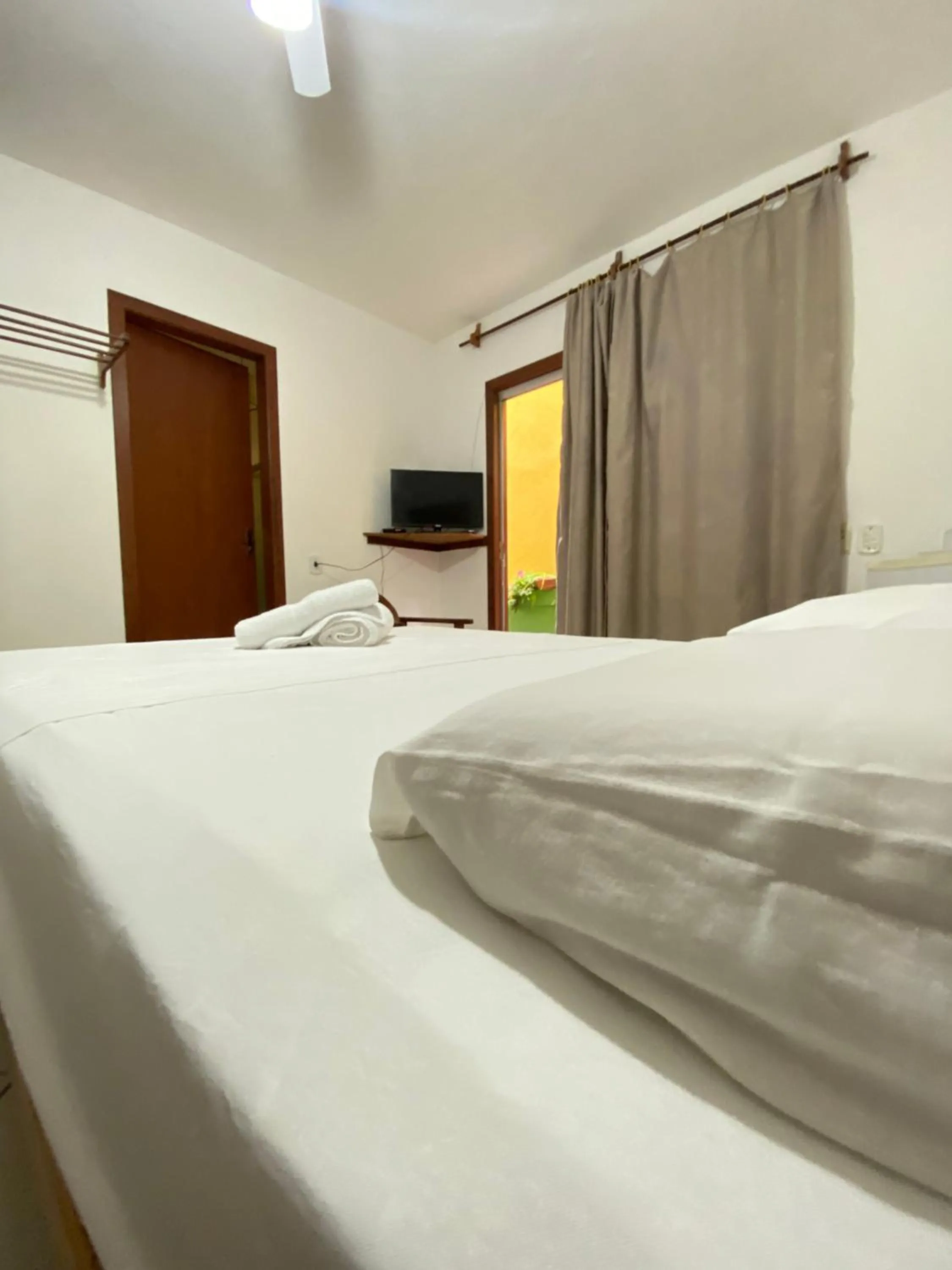 Bed in Pousada Arraial Suites