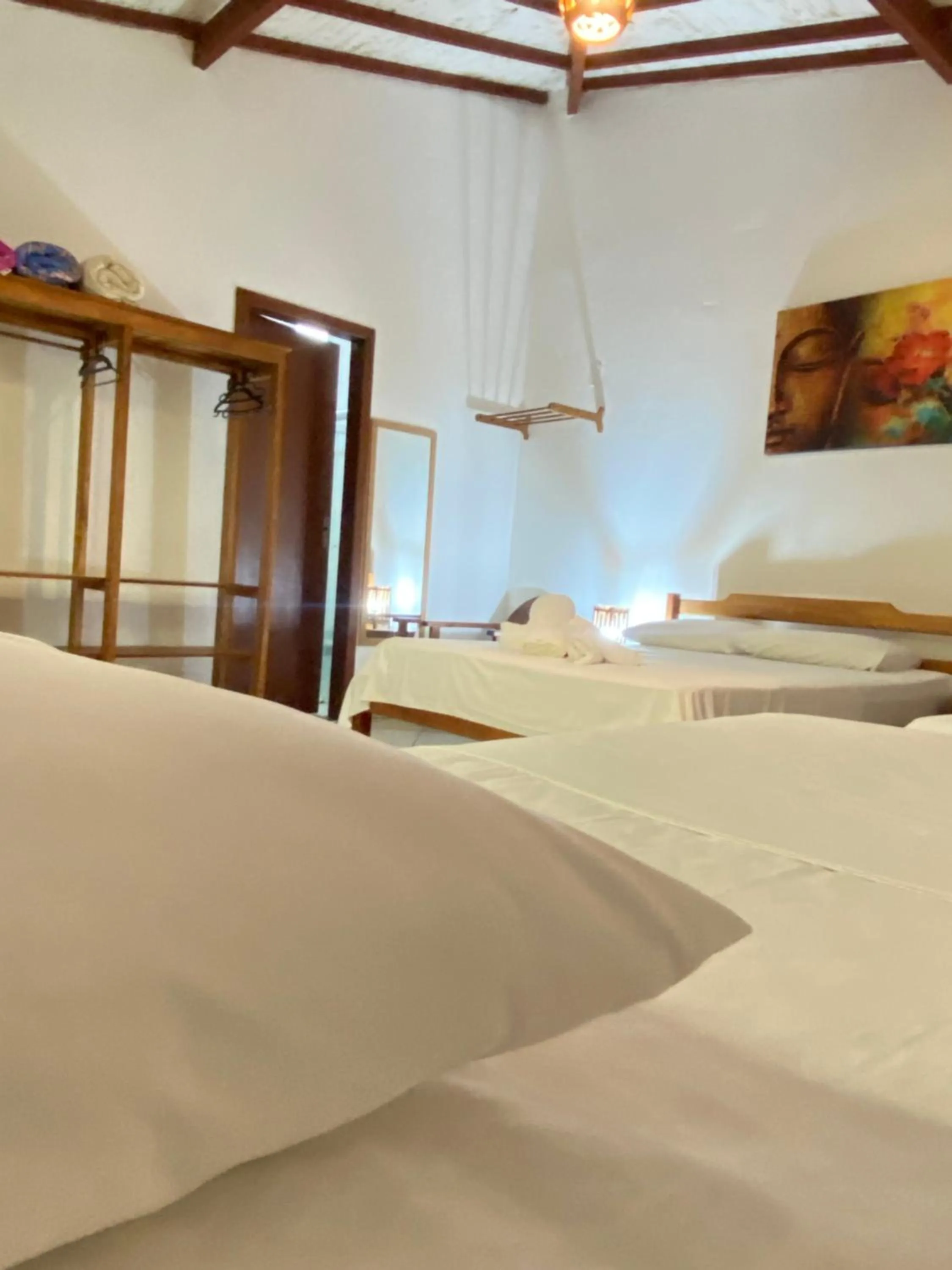 Bed in Pousada Arraial Suites