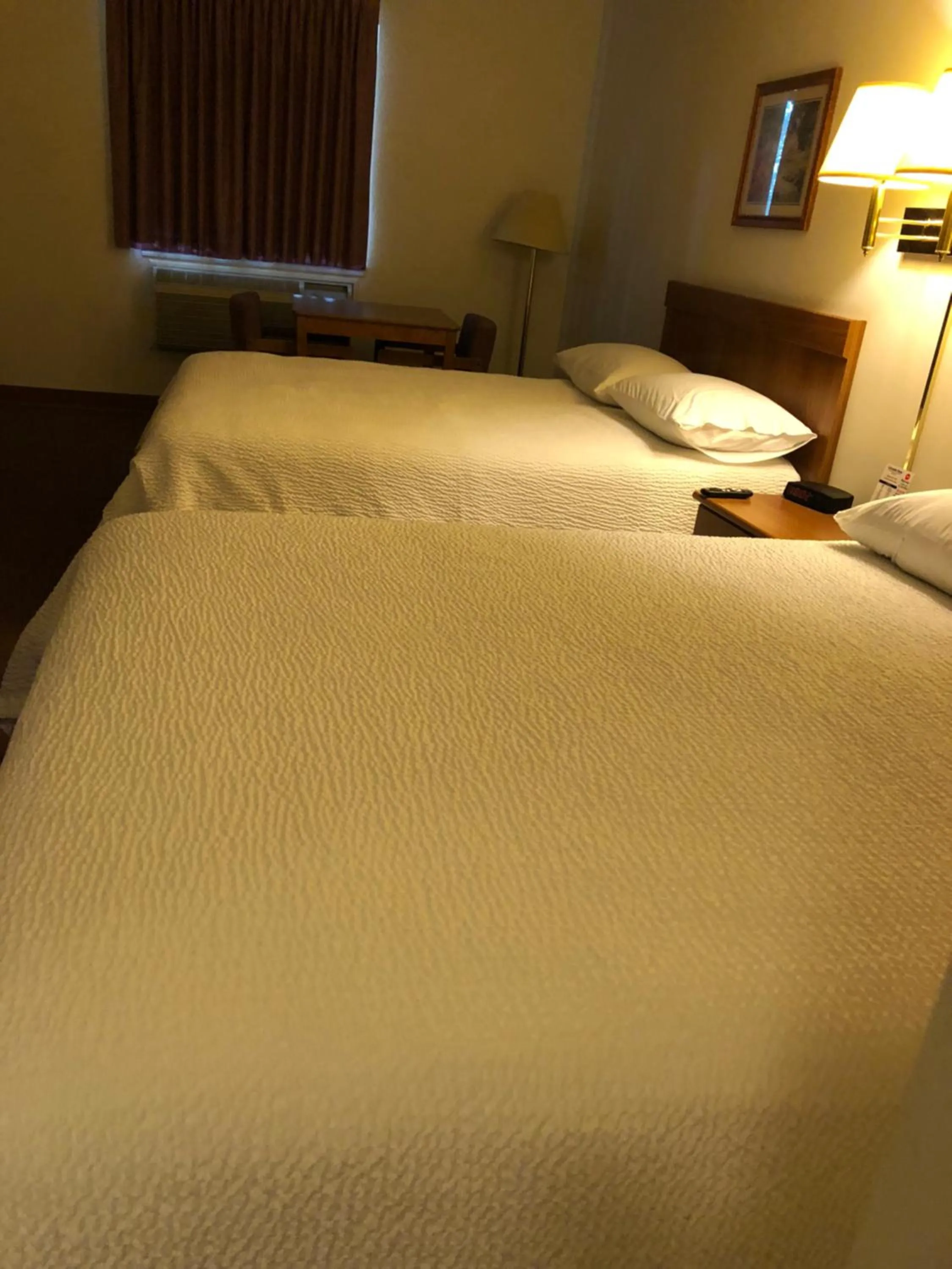 Bed in Coronado Motel & RV Park