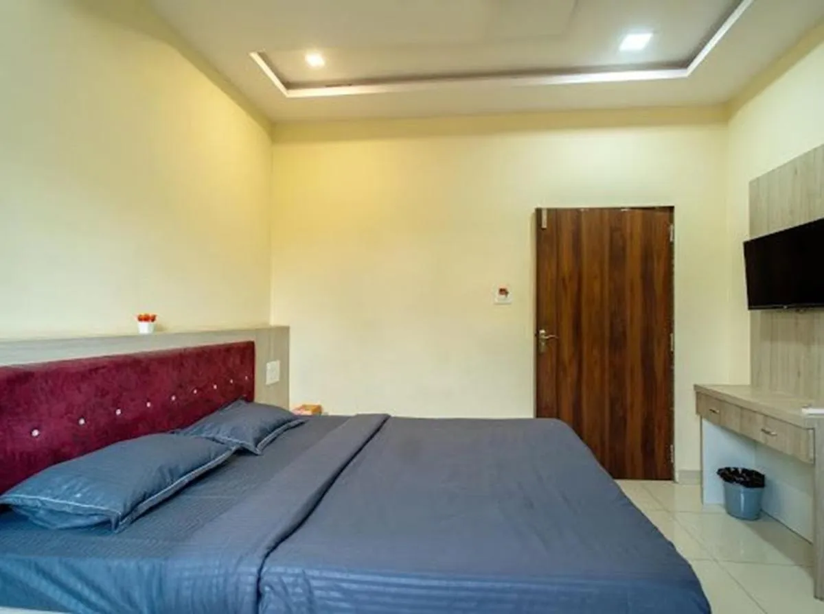 Bed in Majestic Hotel and Restro