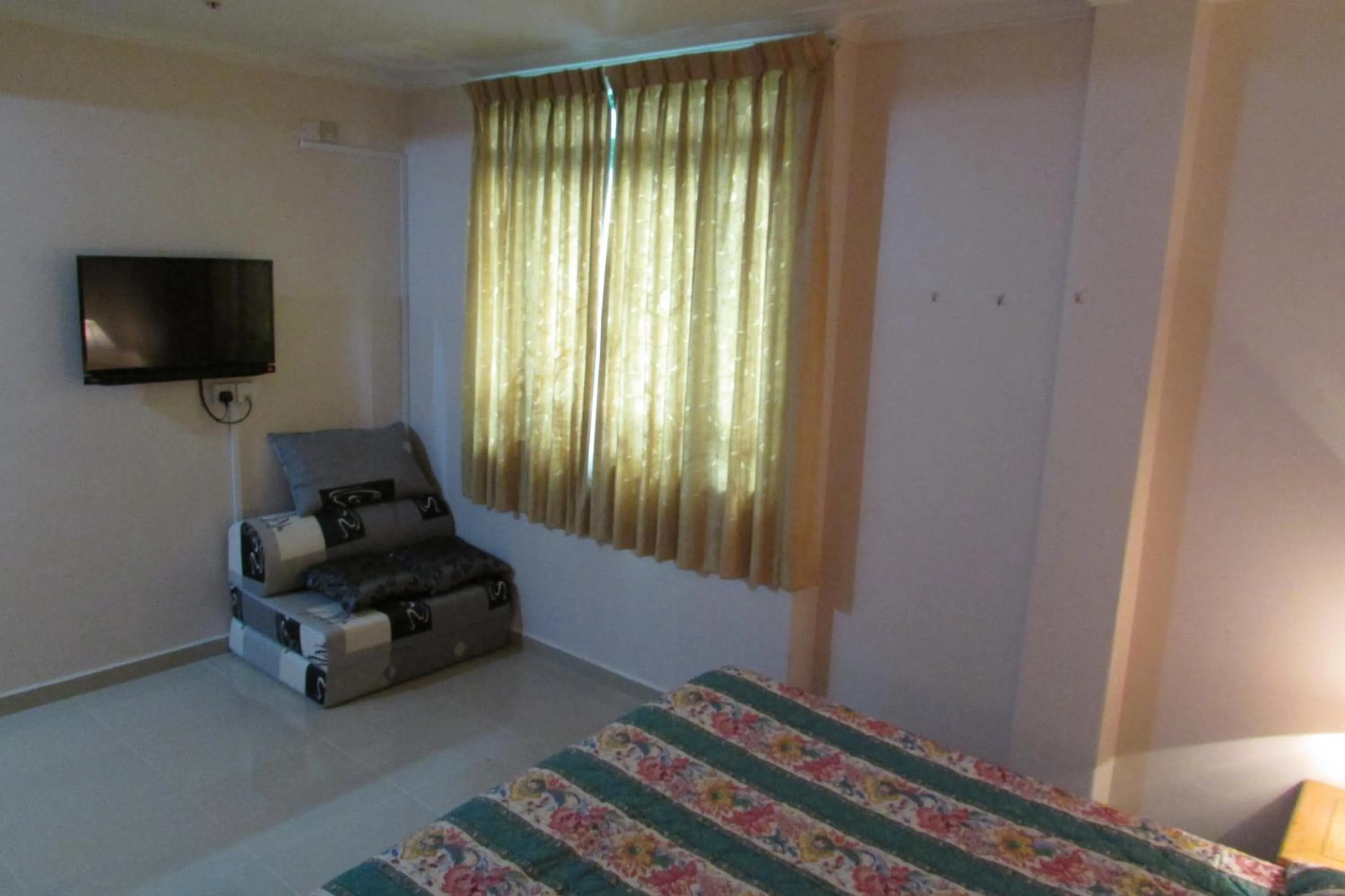 Bed in New Orchid Hotel