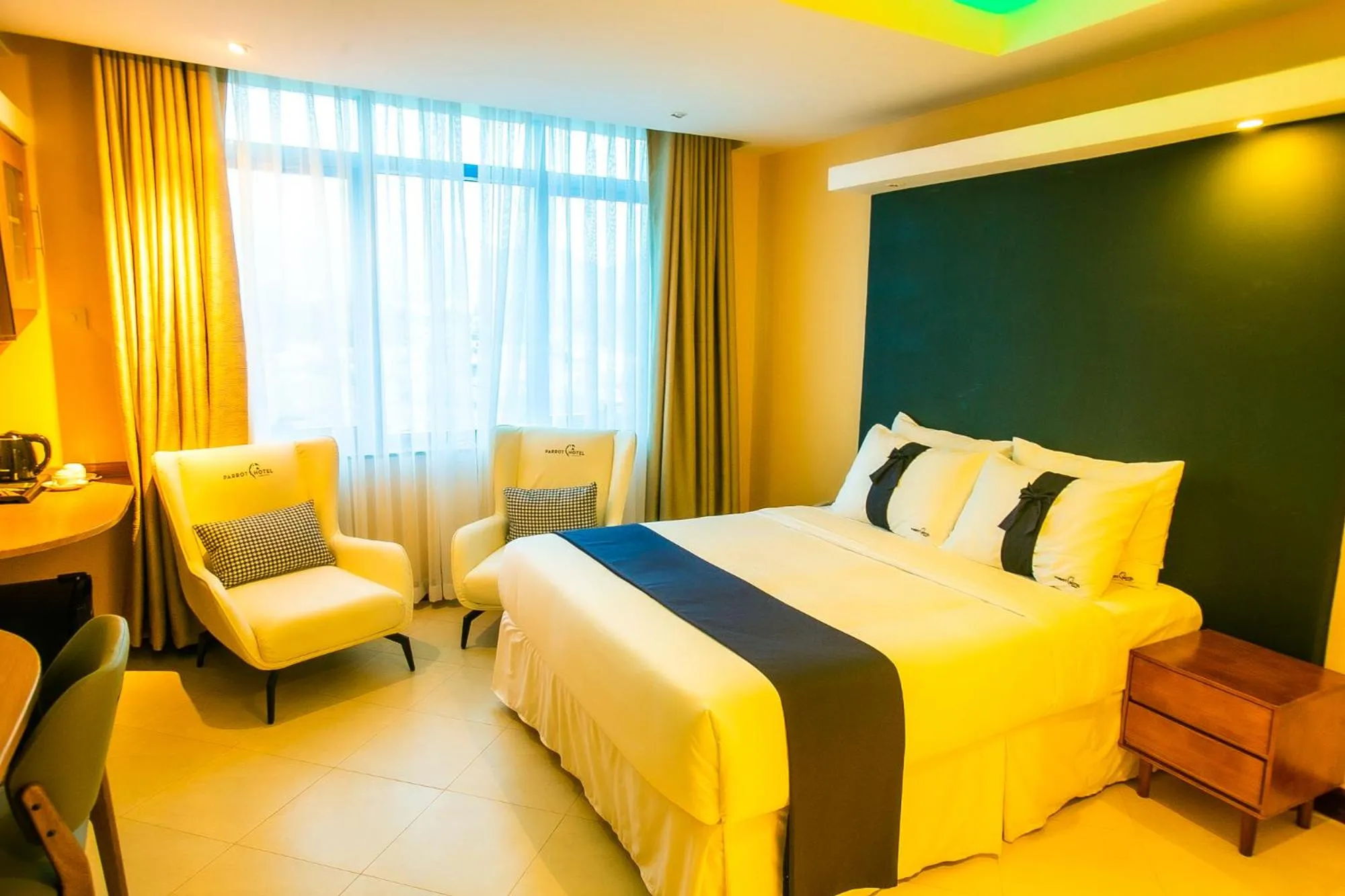 Bed in Parrot Hotel Arusha