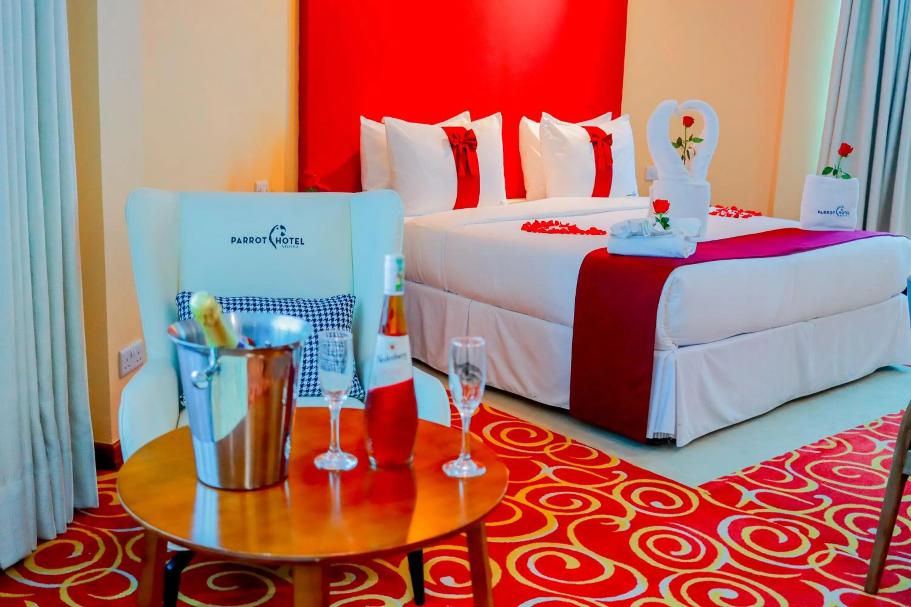 Bed in Parrot Hotel Arusha