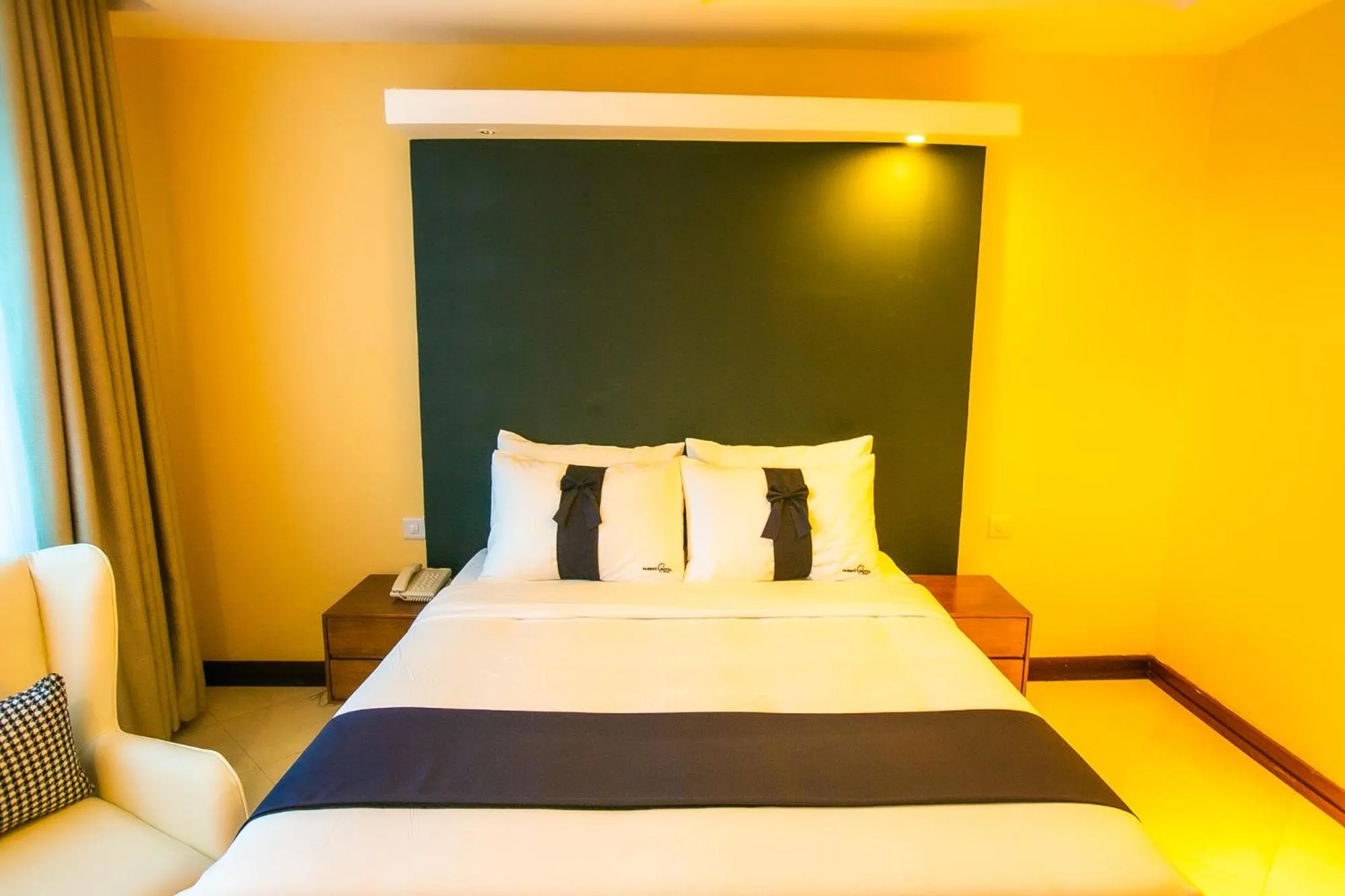 Bed in Parrot Hotel Arusha