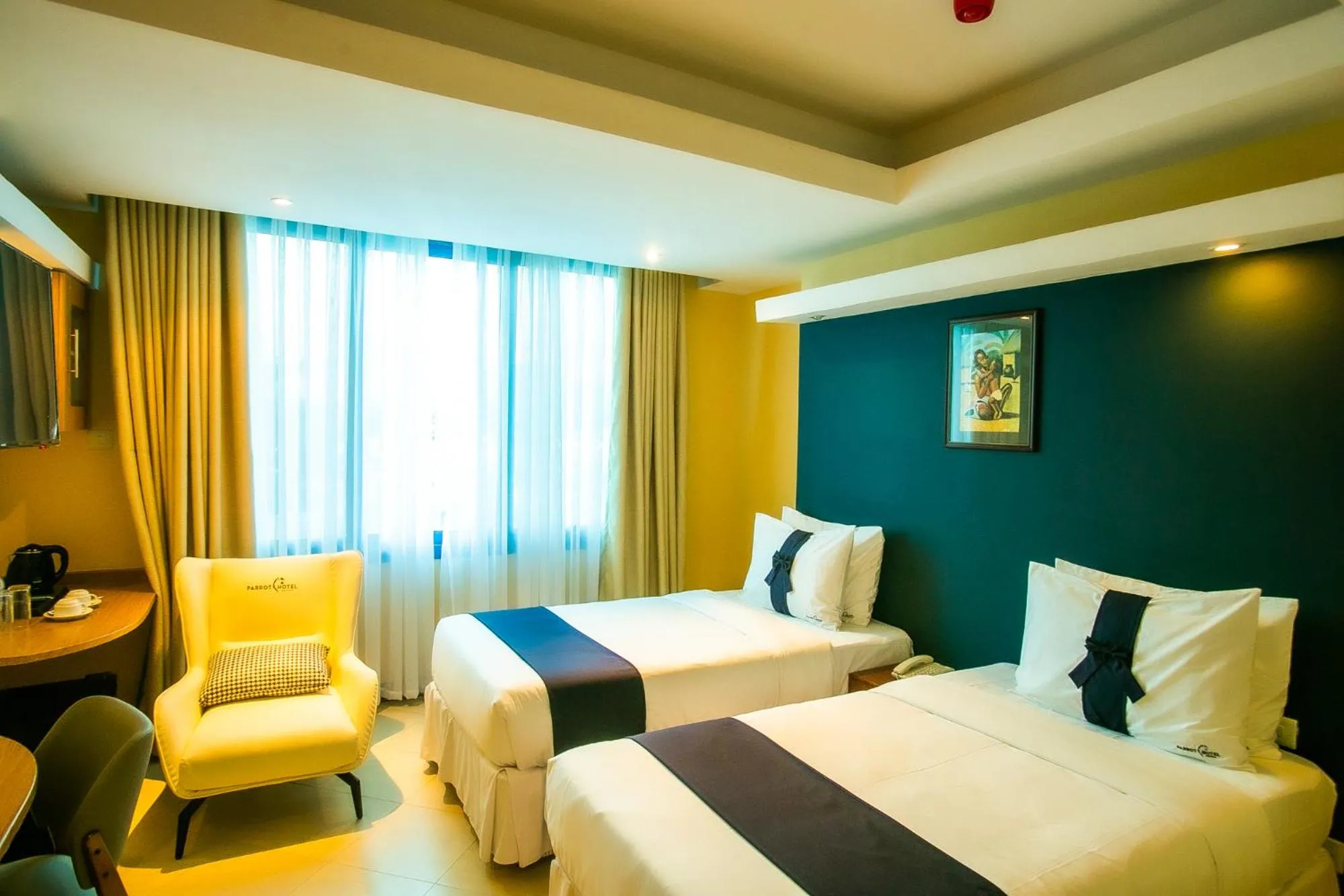 Bed in Parrot Hotel Arusha