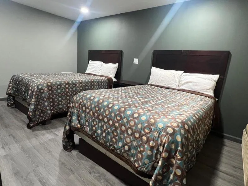 Bed in Red Carpet Inn