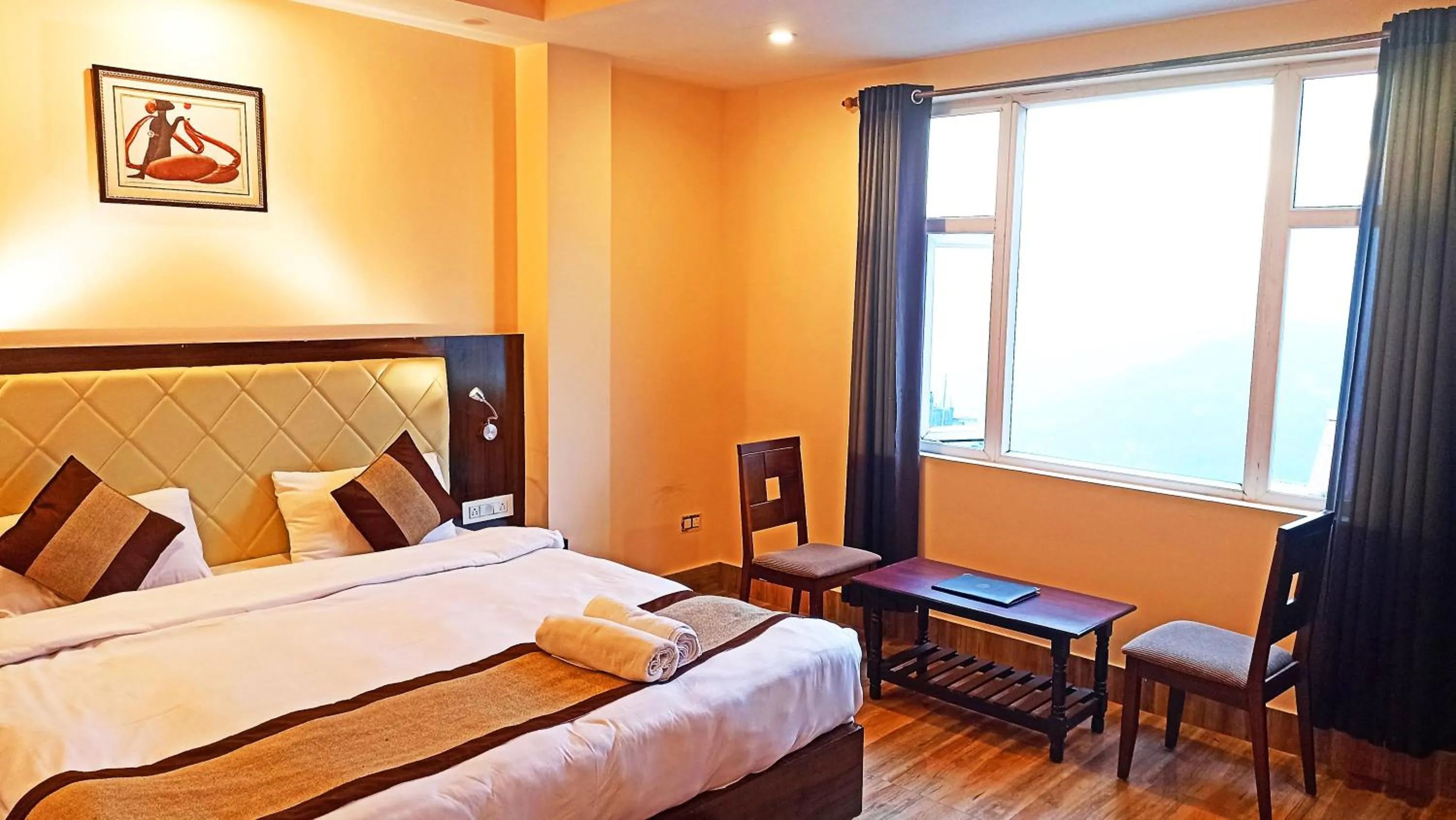 Seating area, Bed in Garden Retreat Hotel