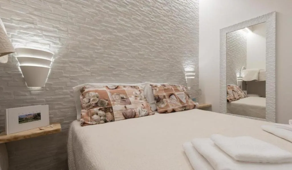 Bed in Le Gemelle Boutique Hotel