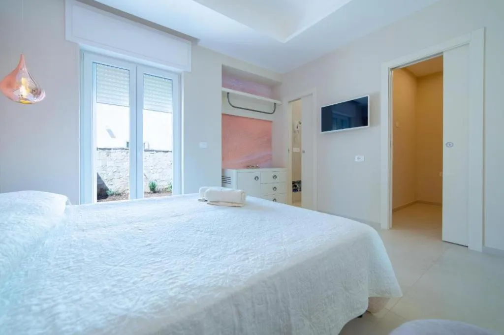 Bed in Le Gemelle Boutique Hotel