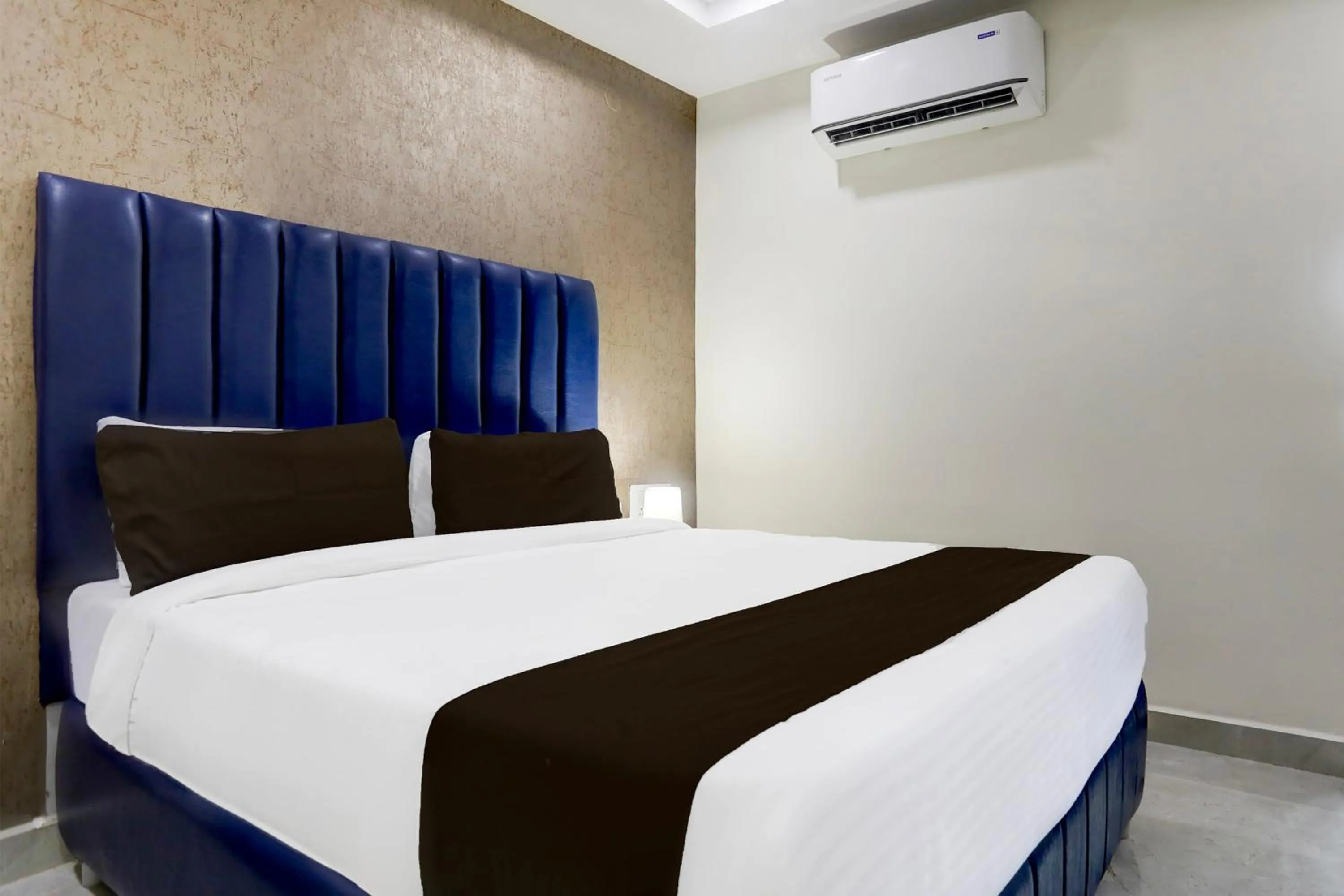 Bedroom, Bed in Super Townhouse Khammam Formerly Bluemoon