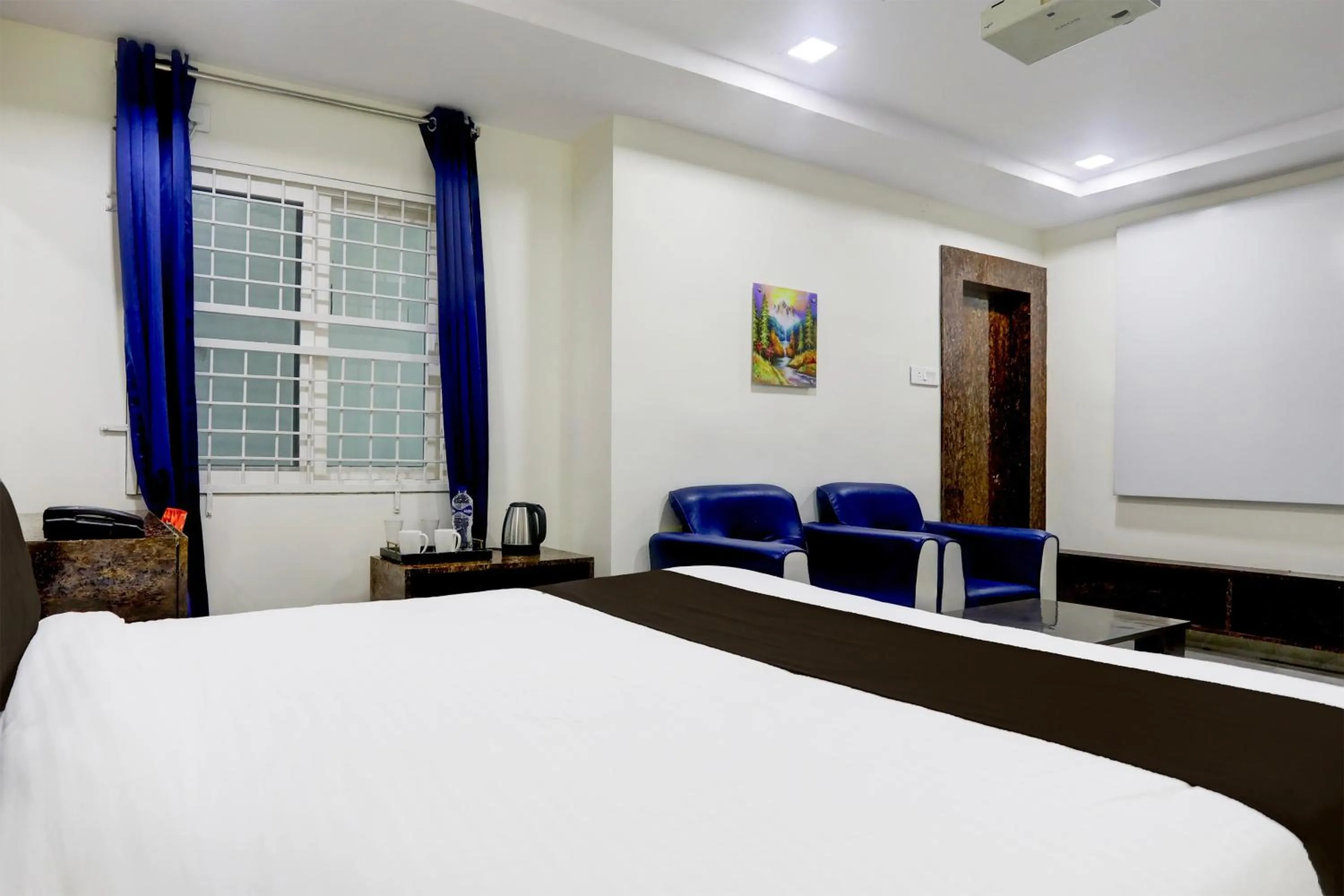 Bedroom, Bed in Super Townhouse Khammam Formerly Bluemoon
