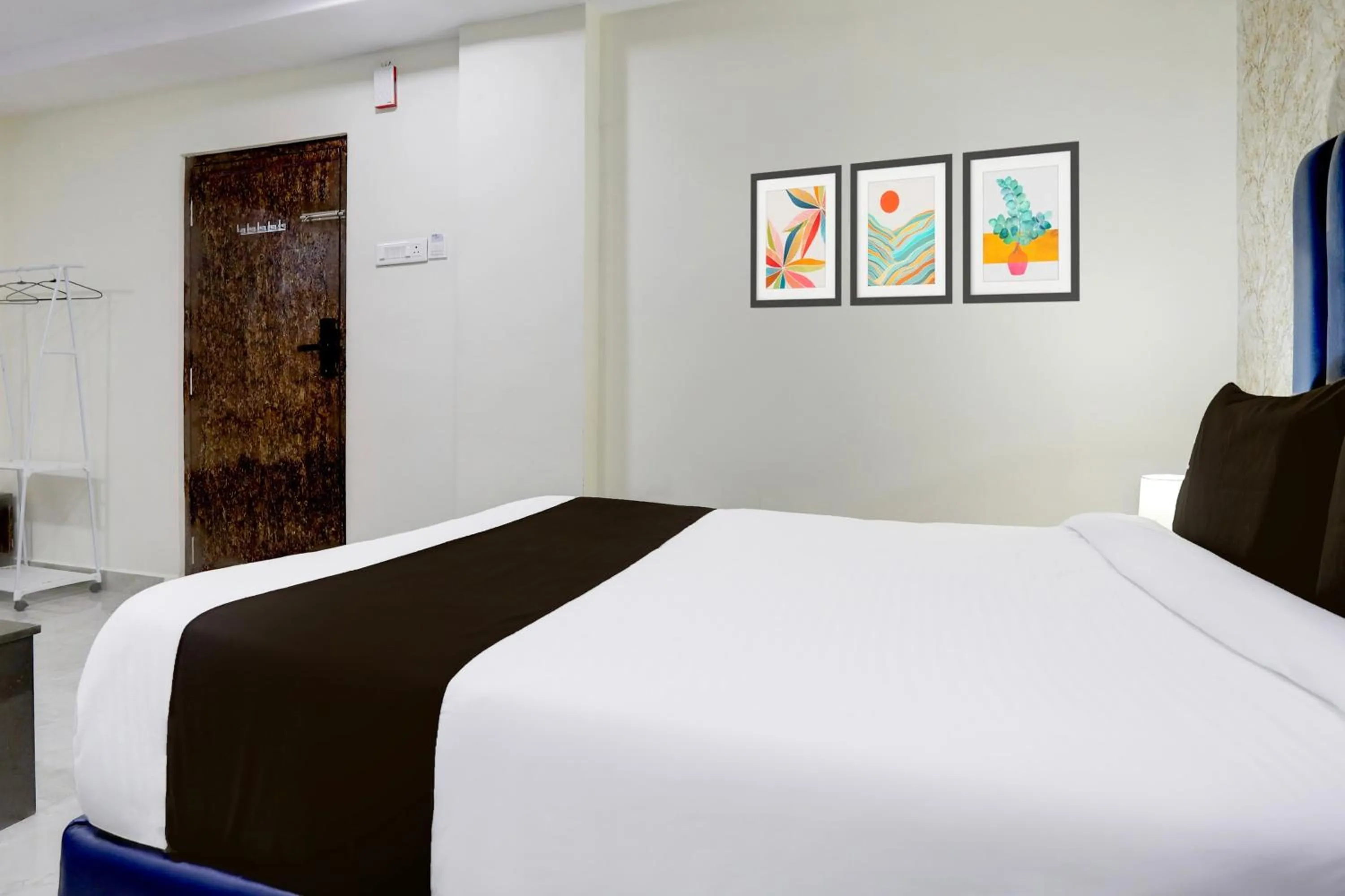 Bedroom, Bed in Super Townhouse Khammam Formerly Bluemoon