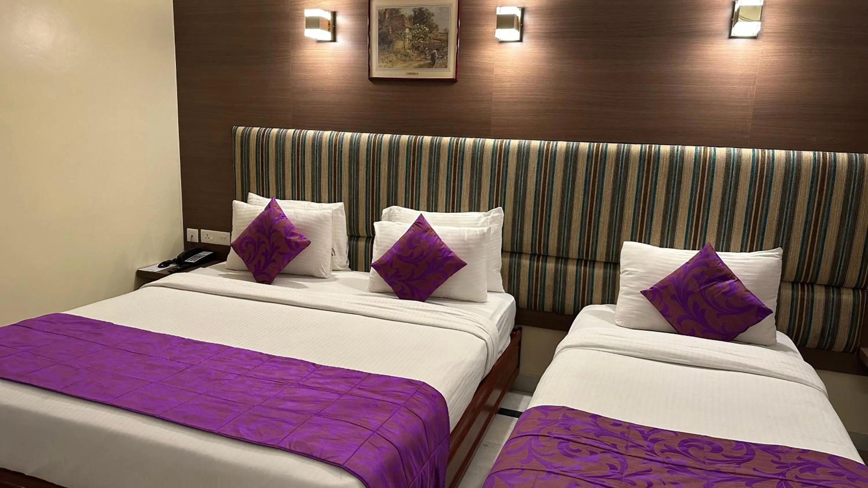Bed in Hotel Annamalai International