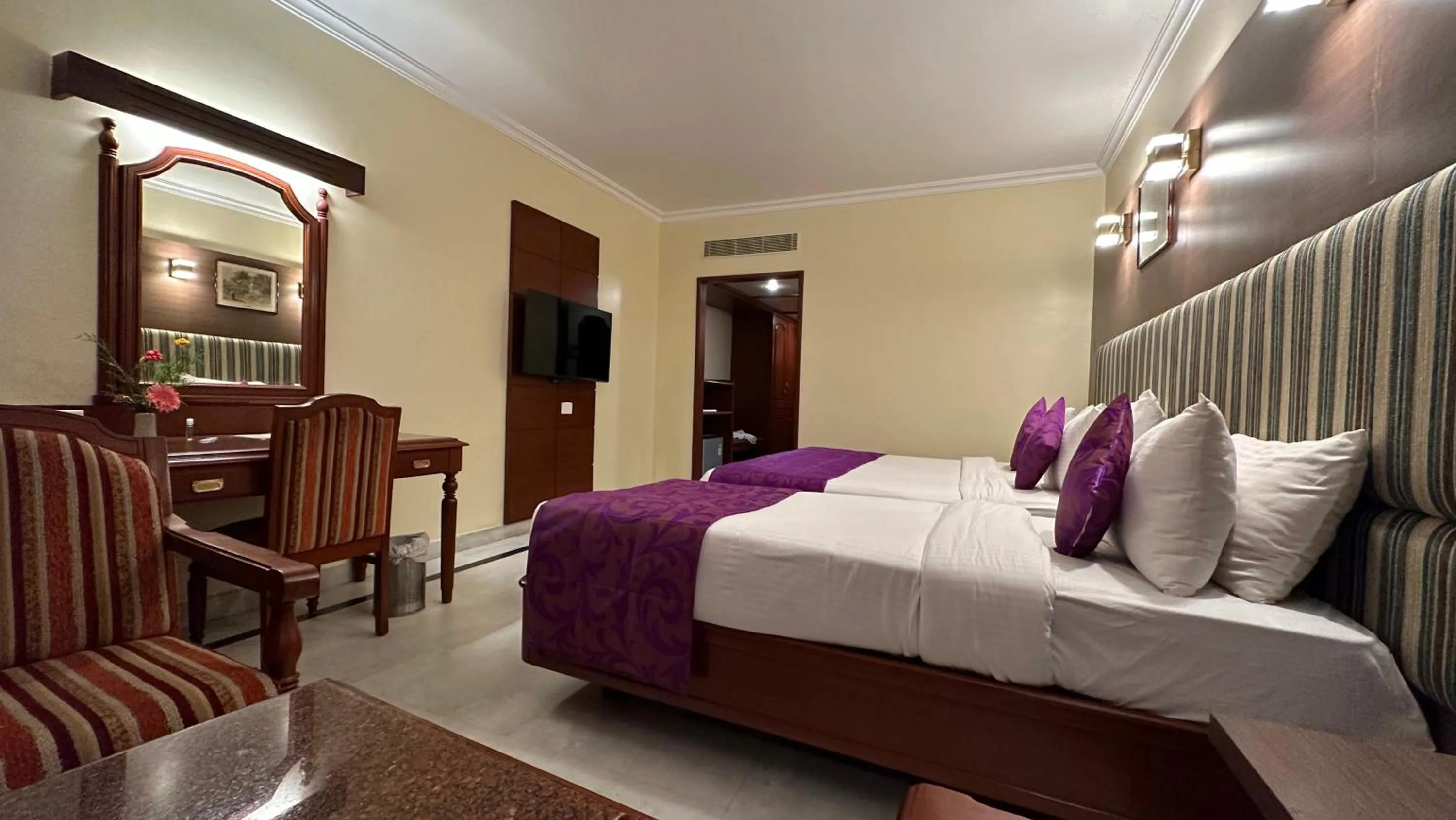 Bed in Hotel Annamalai International