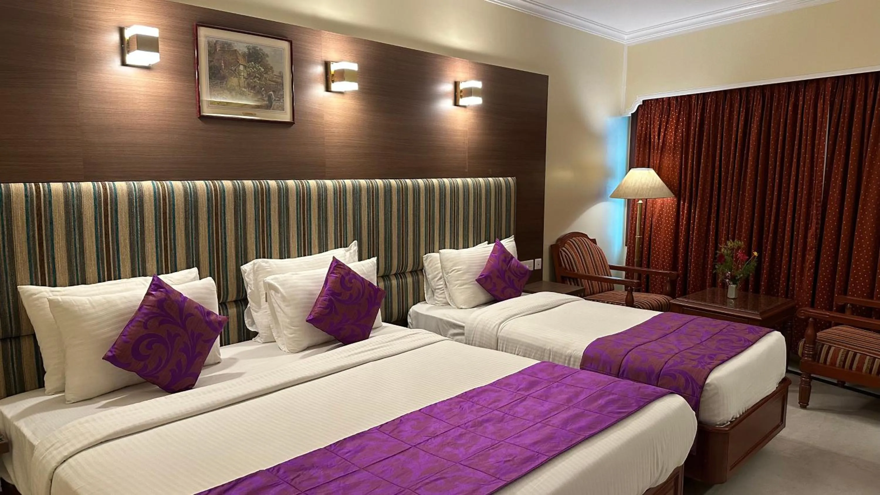 Seating area, Bed in Hotel Annamalai International