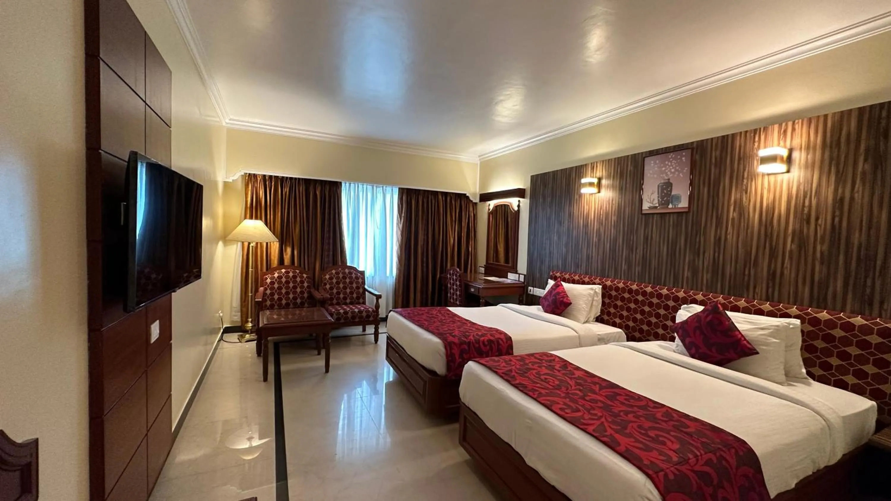 Bed in Hotel Annamalai International