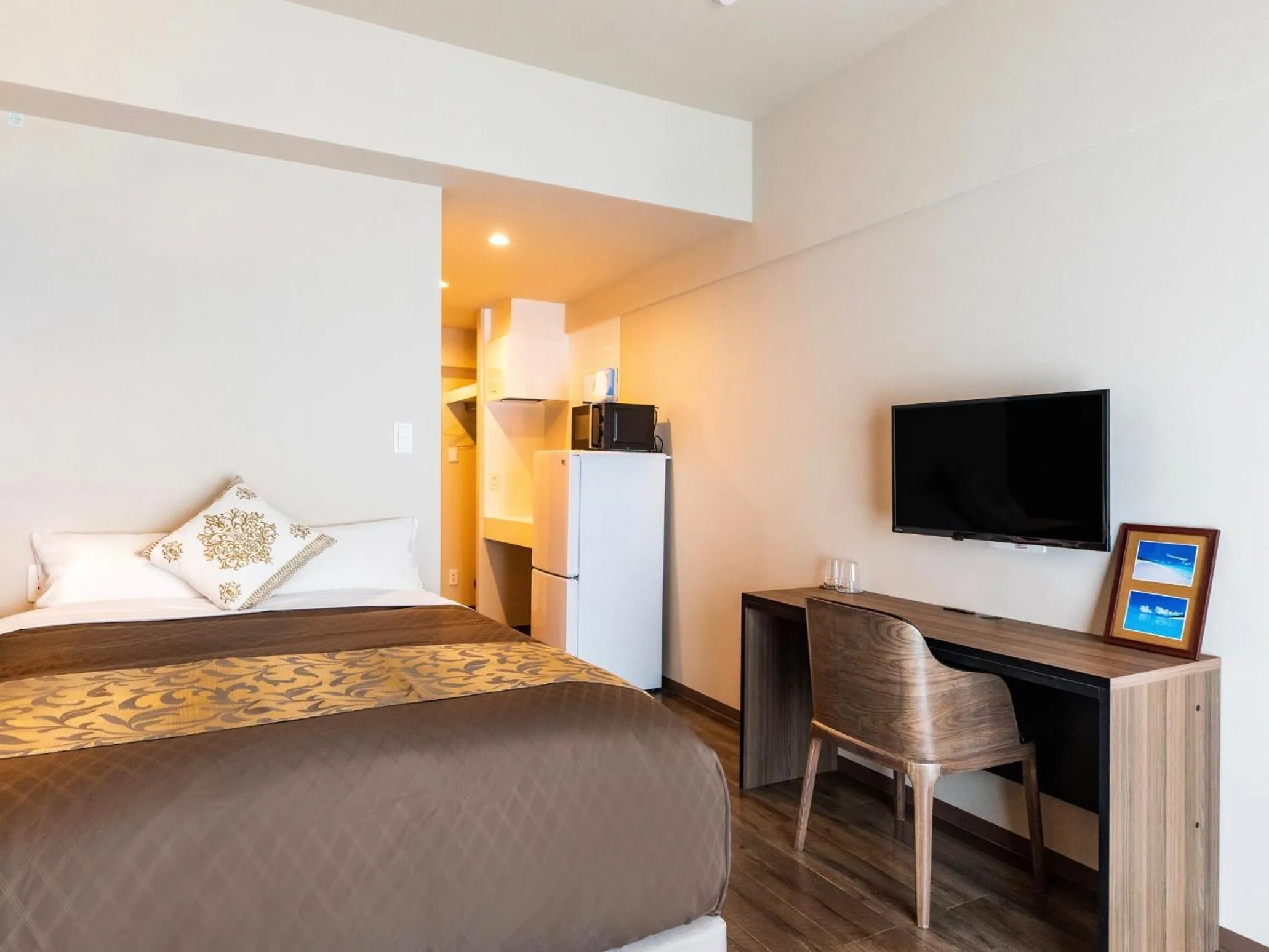 Bed in CONDOMINIUM HOTEL Riyuka in KADENA 1