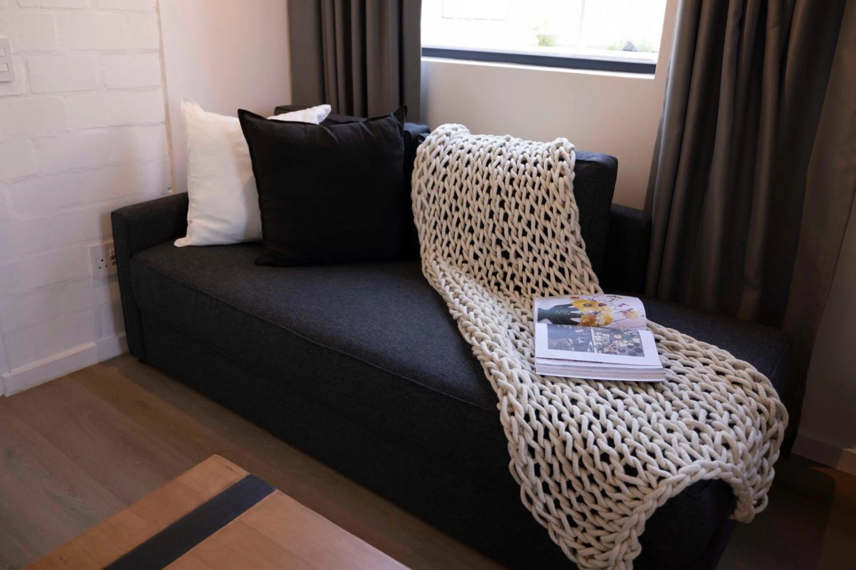 Living room, Bed in EIGHTY2 ON M - Fluent Serviced Apartments