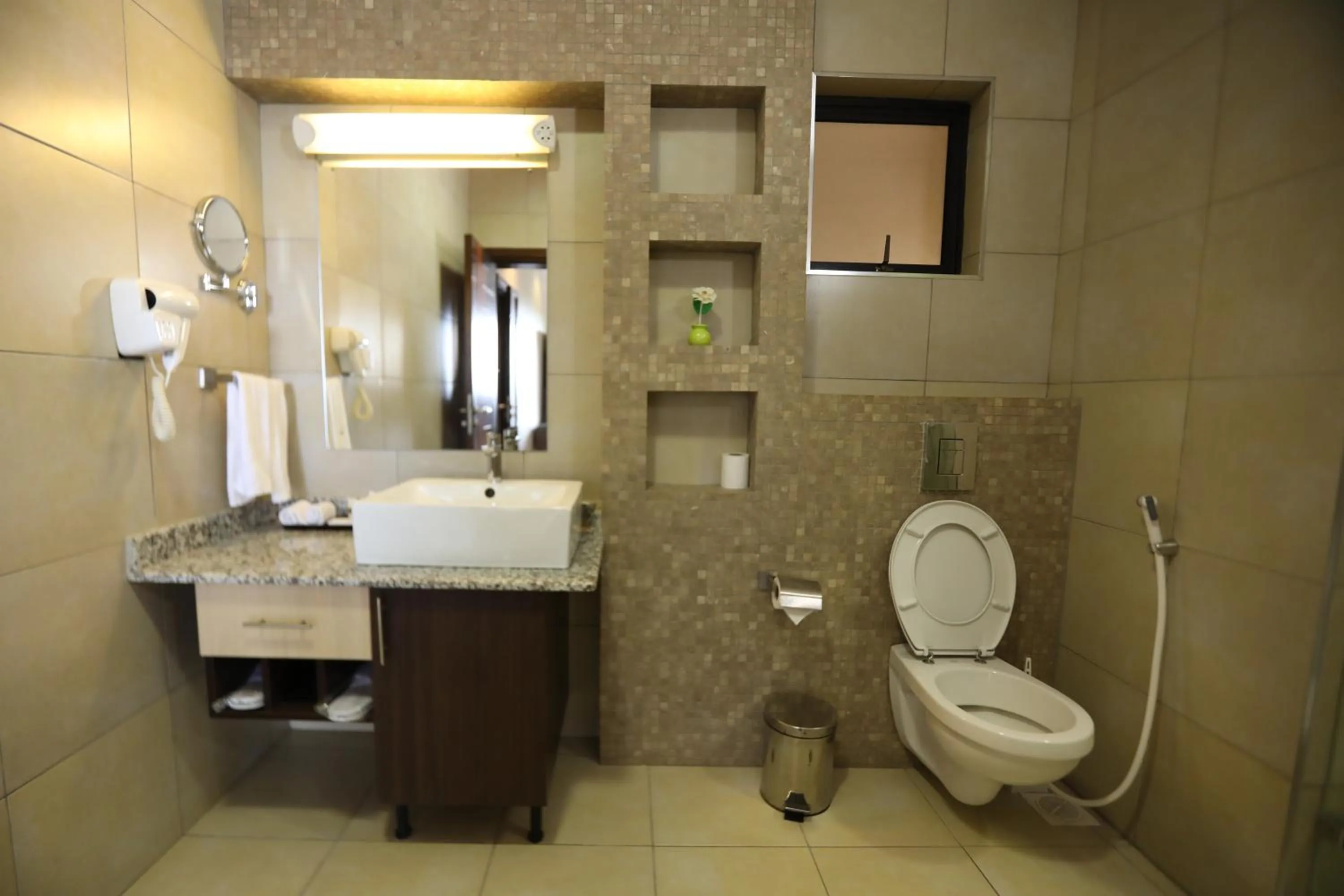 Toilet in Bidwood Suite Hotel