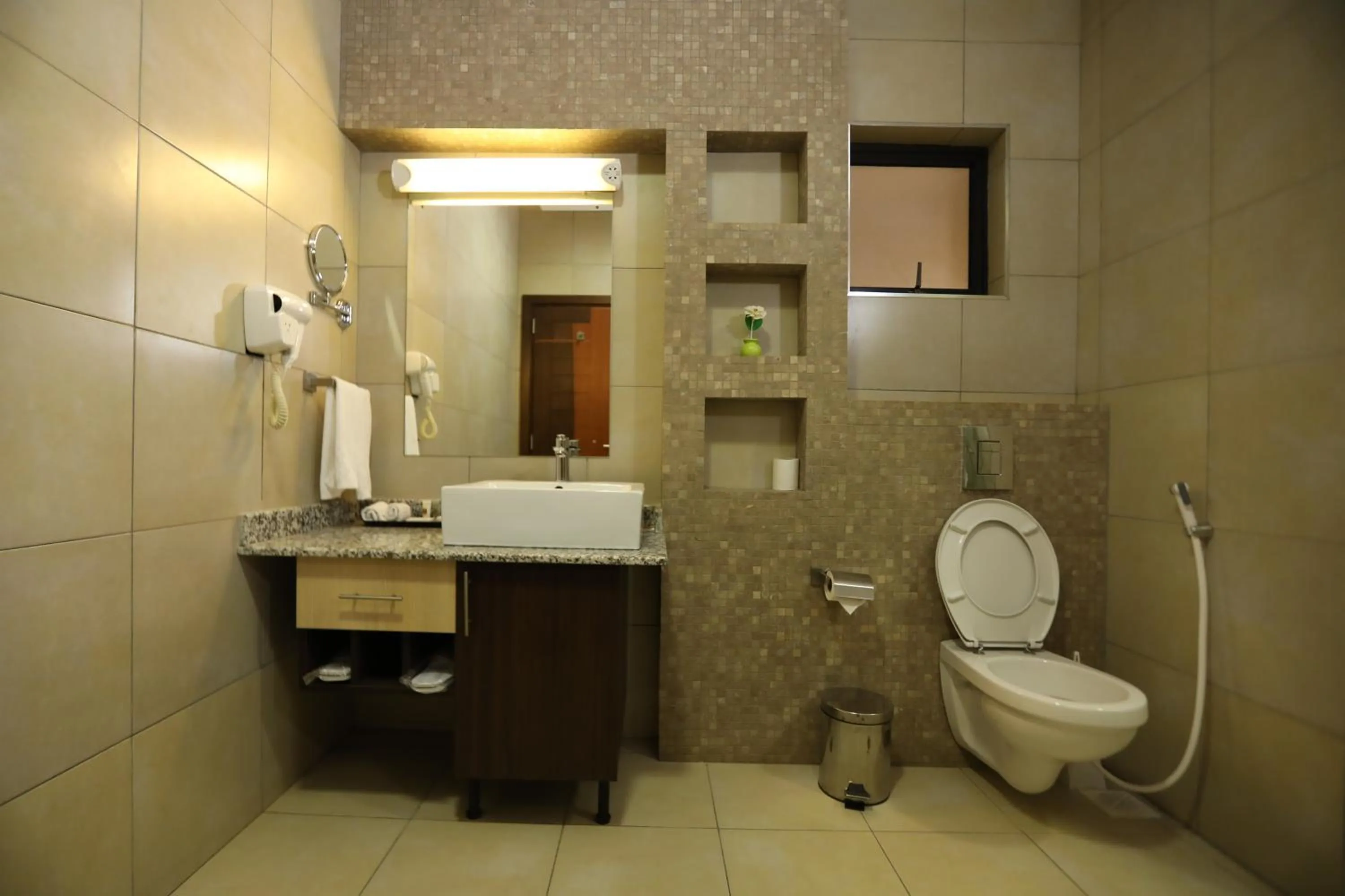 Toilet in Bidwood Suite Hotel