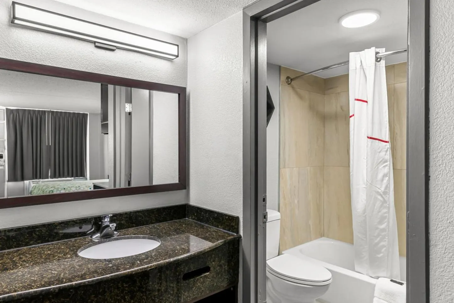 Bathroom in HomeTowne Studios by Red Roof Richmond - Airport Sandston
