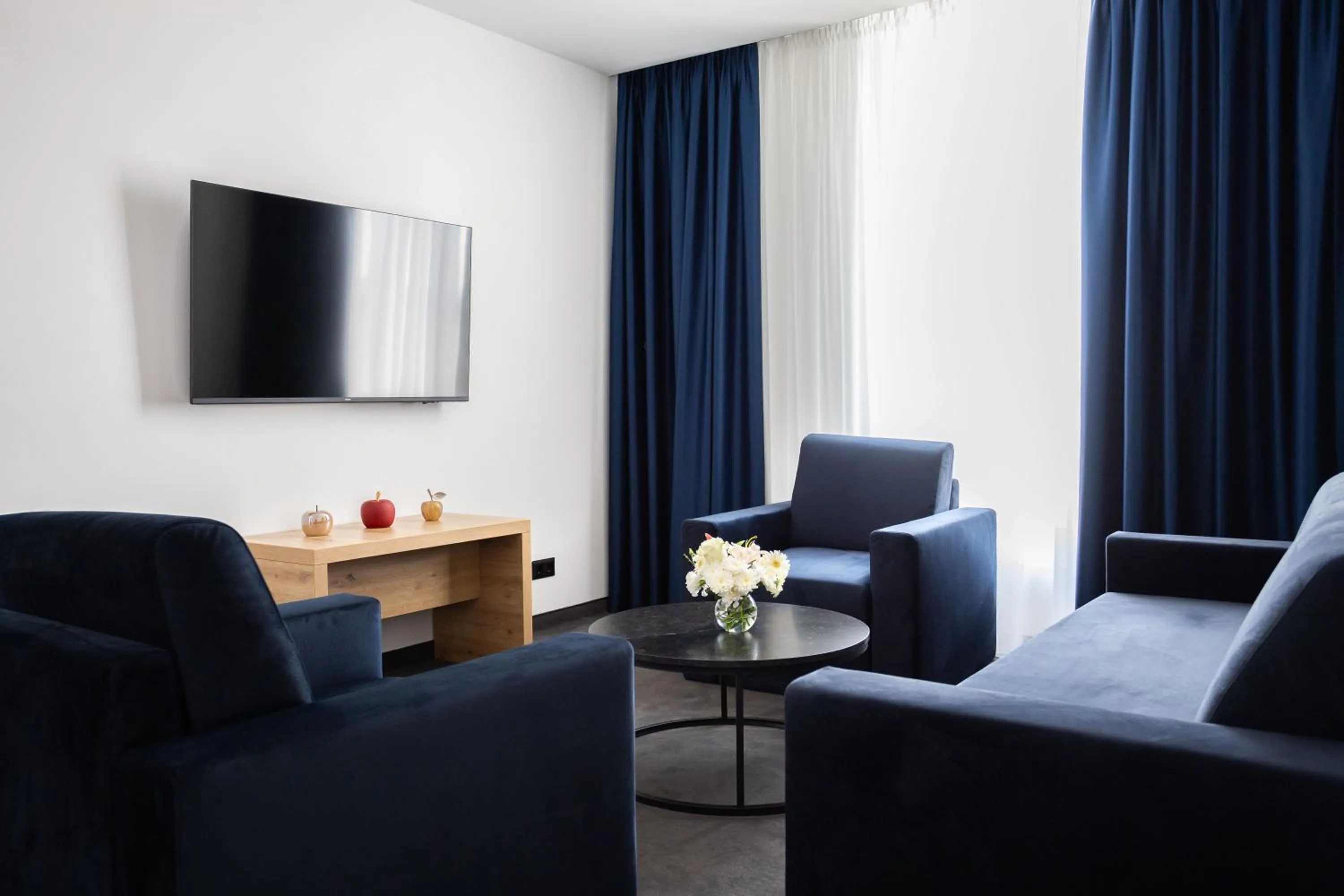 Communal lounge/ TV room in Blue Star Luxury Hotel