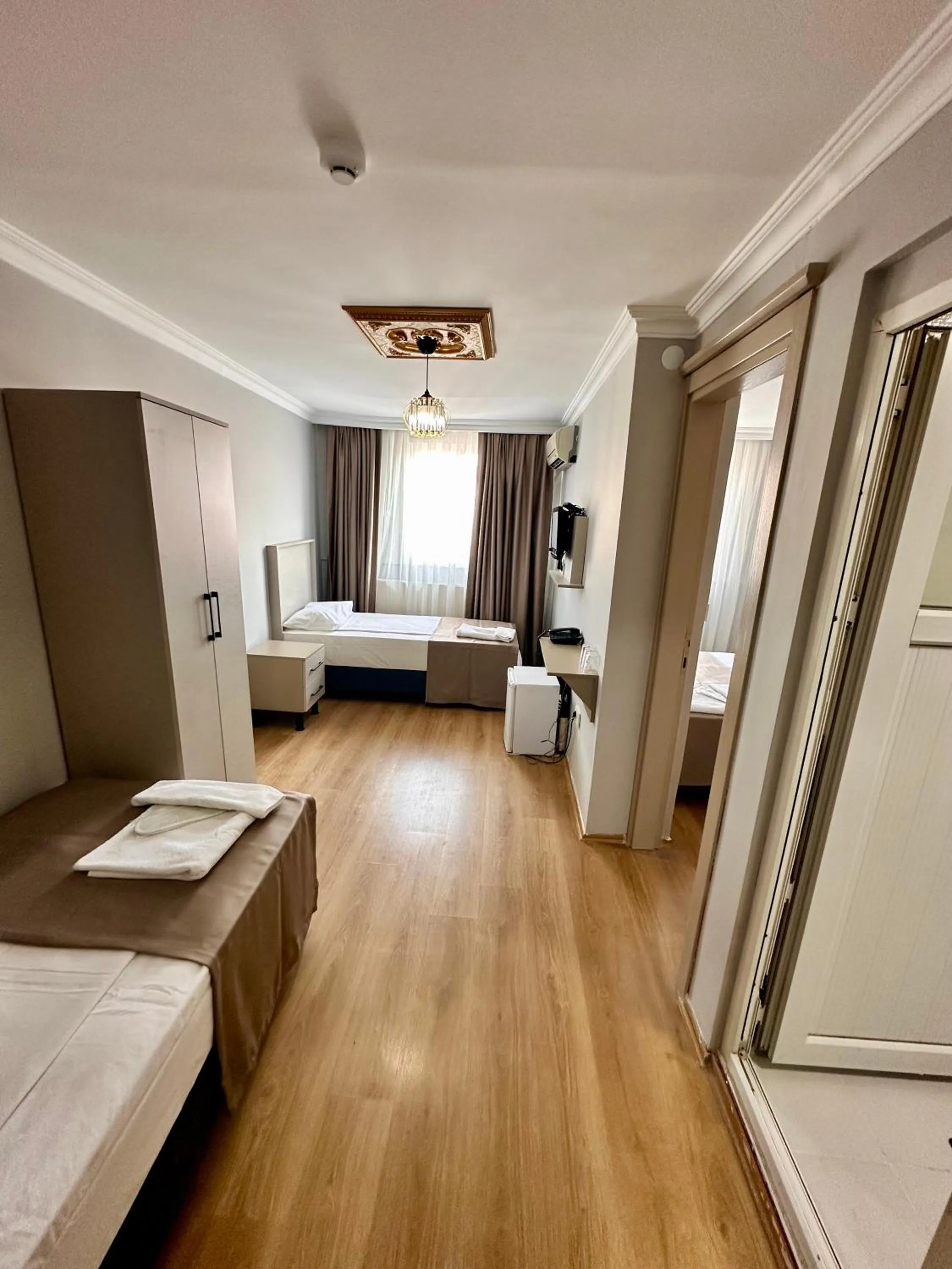 Photo of the whole room, Bed in Crowned Exclusive Hotel