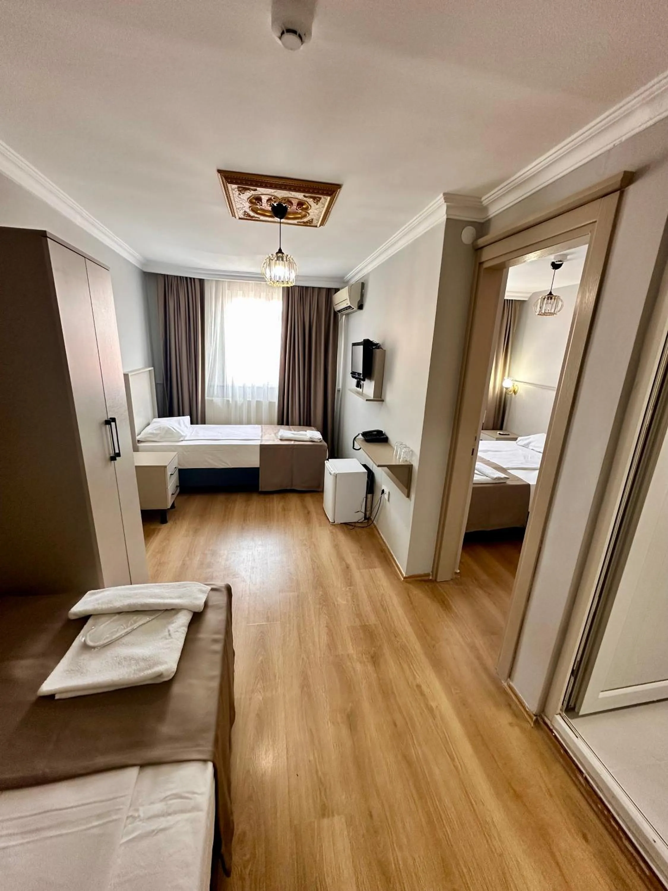 Photo of the whole room, Bed in Crowned Exclusive Hotel