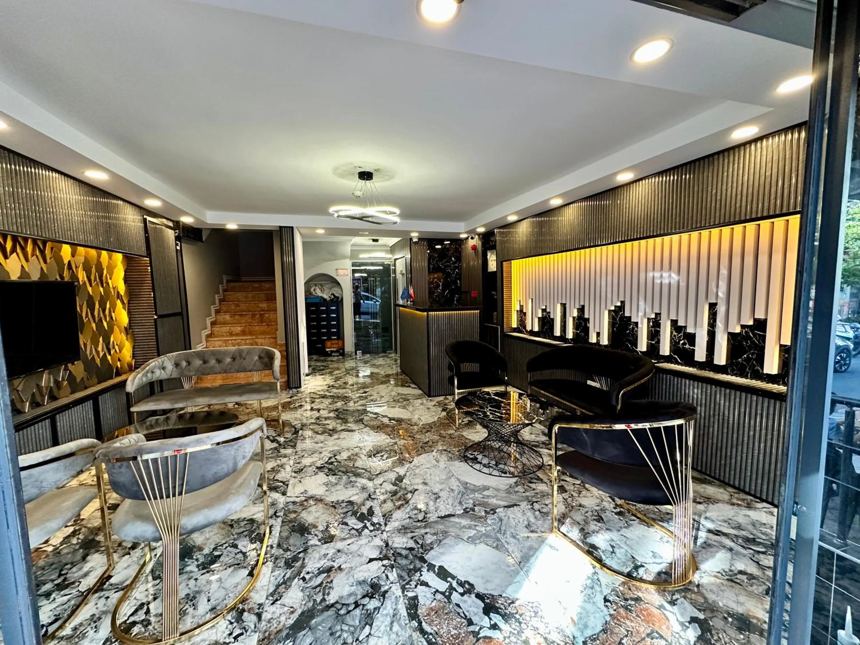 Communal lounge/ TV room in Crowned Exclusive Hotel