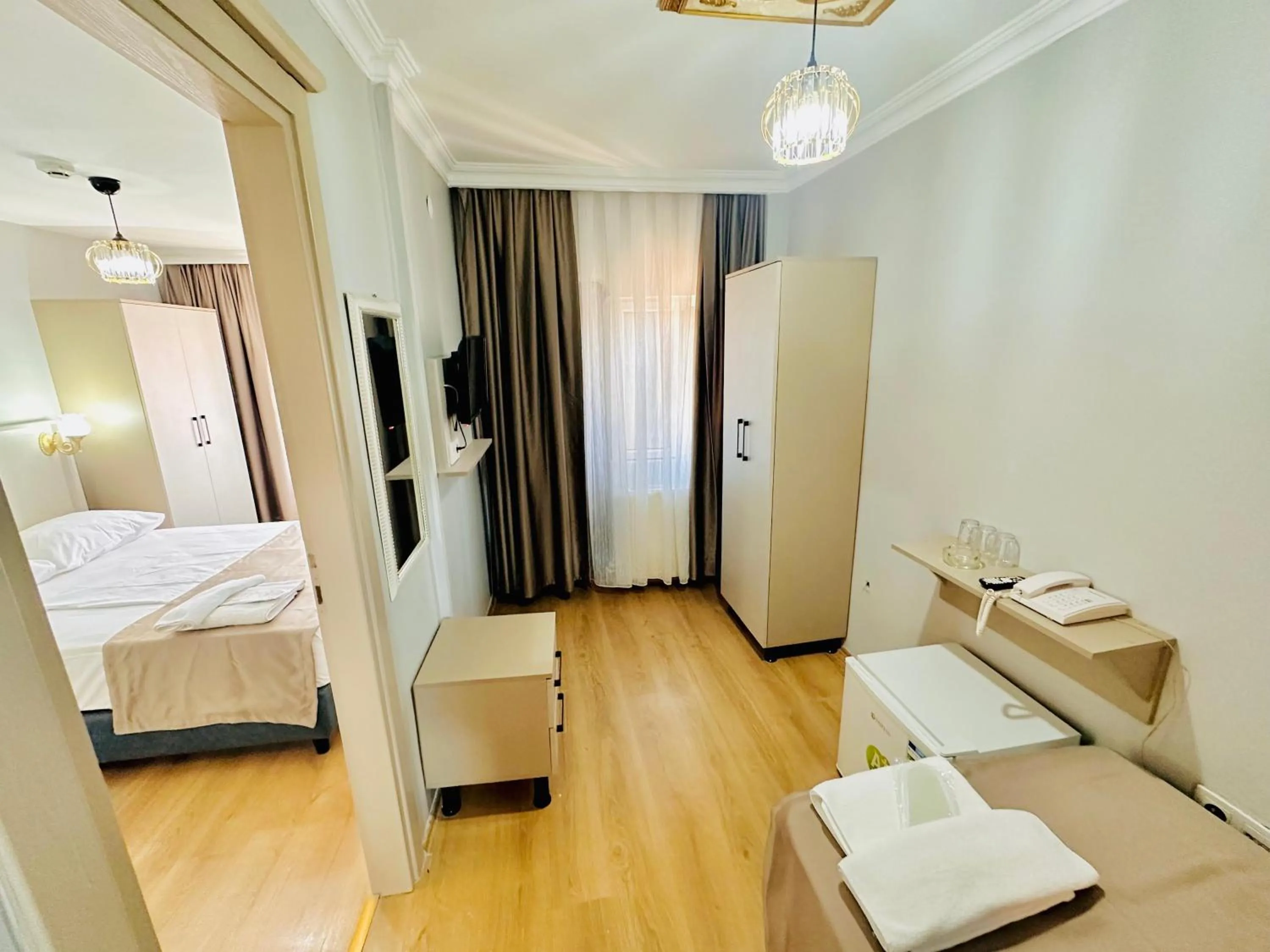 Photo of the whole room, Bed in Crowned Exclusive Hotel