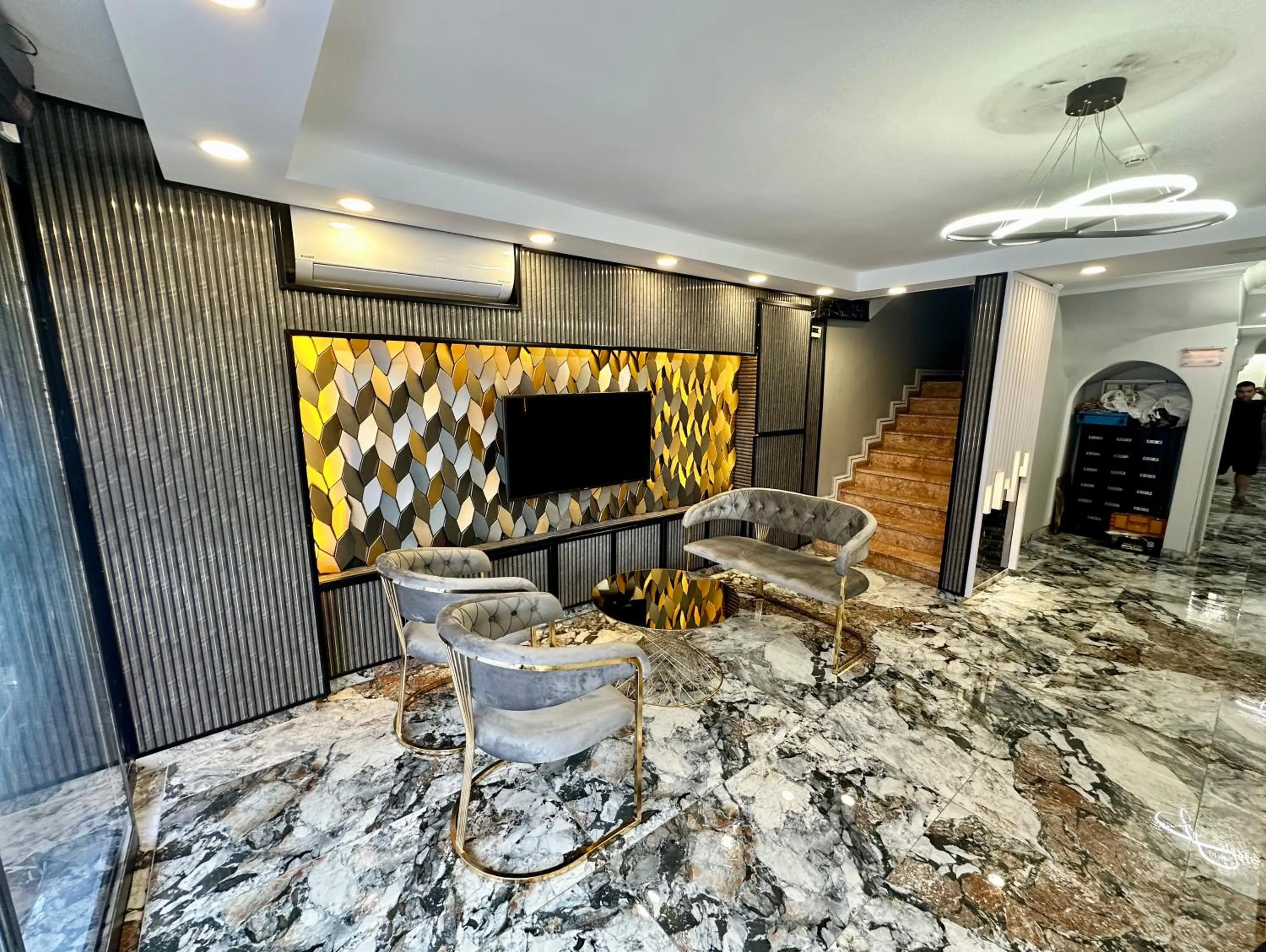 Communal lounge/ TV room in Crowned Exclusive Hotel