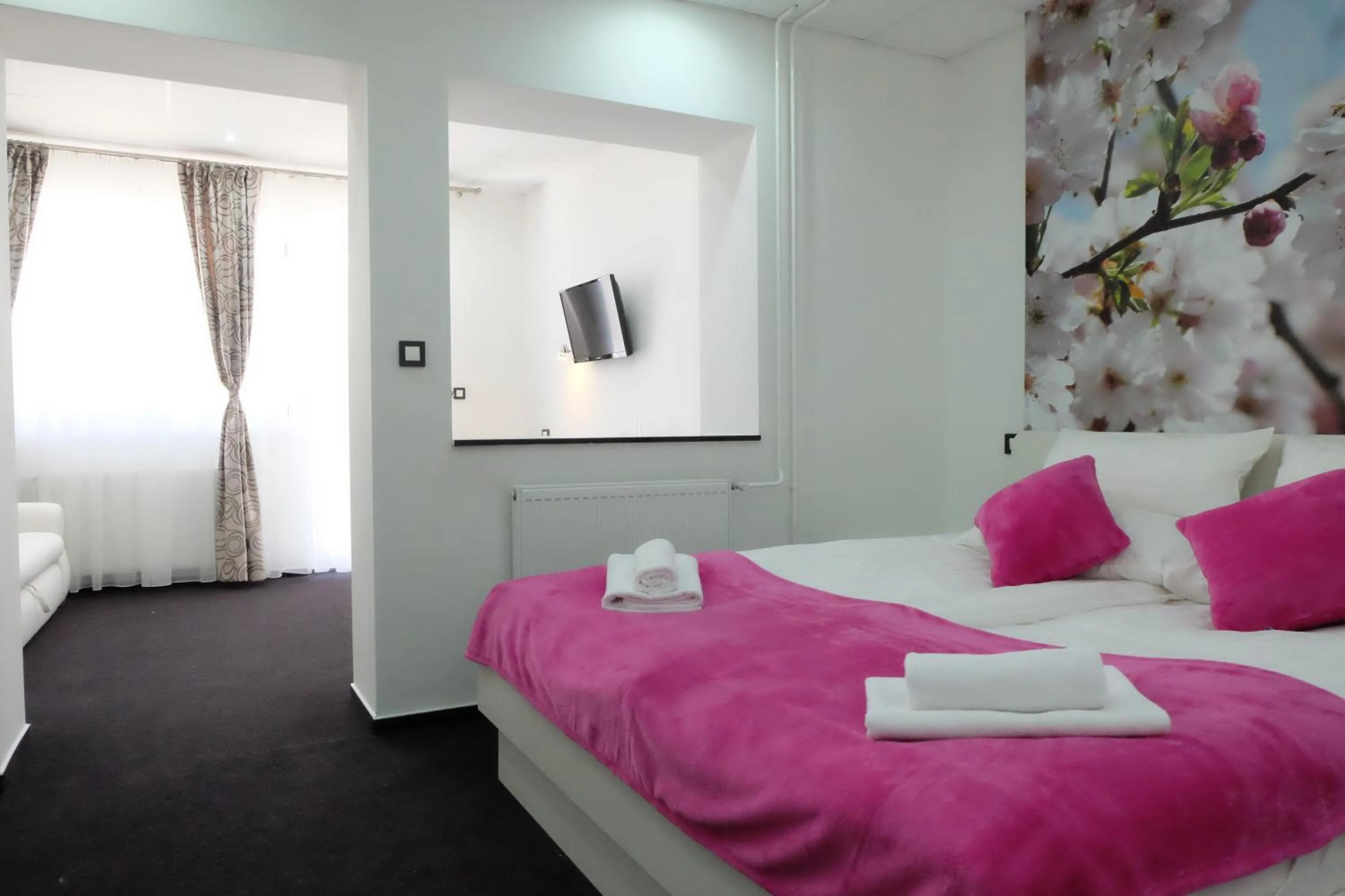 Bed in Luwiana Suites