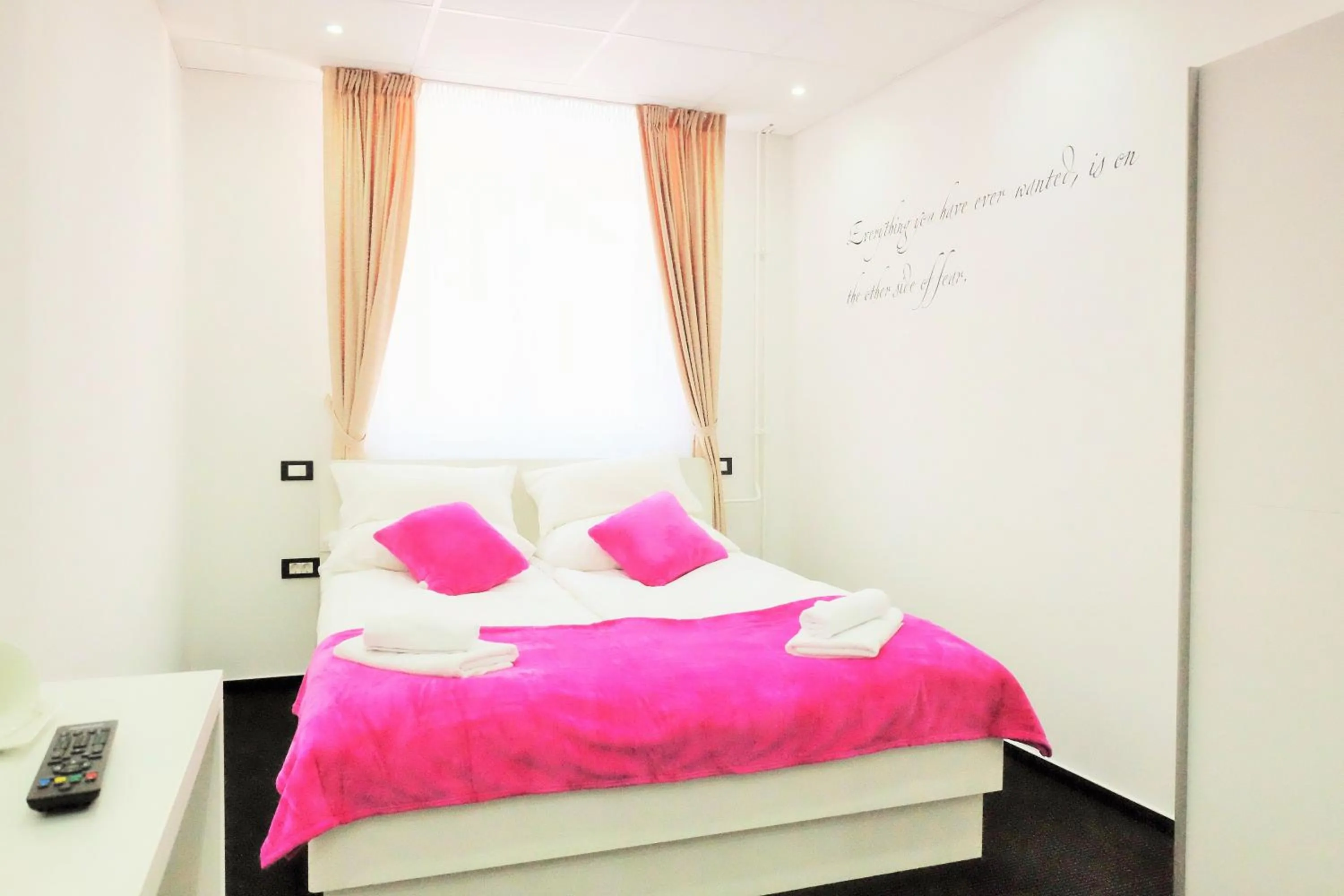 Bed in Luwiana Suites