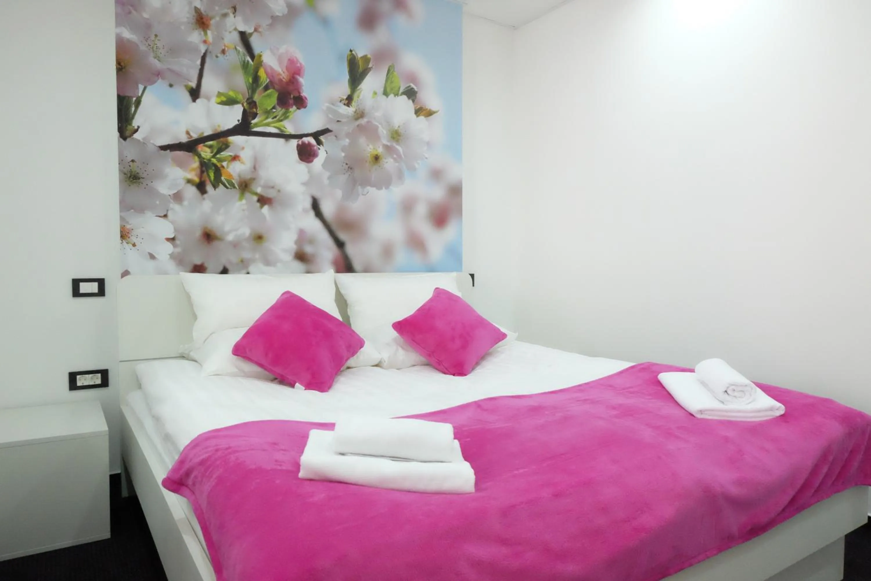 Bed in Luwiana Suites