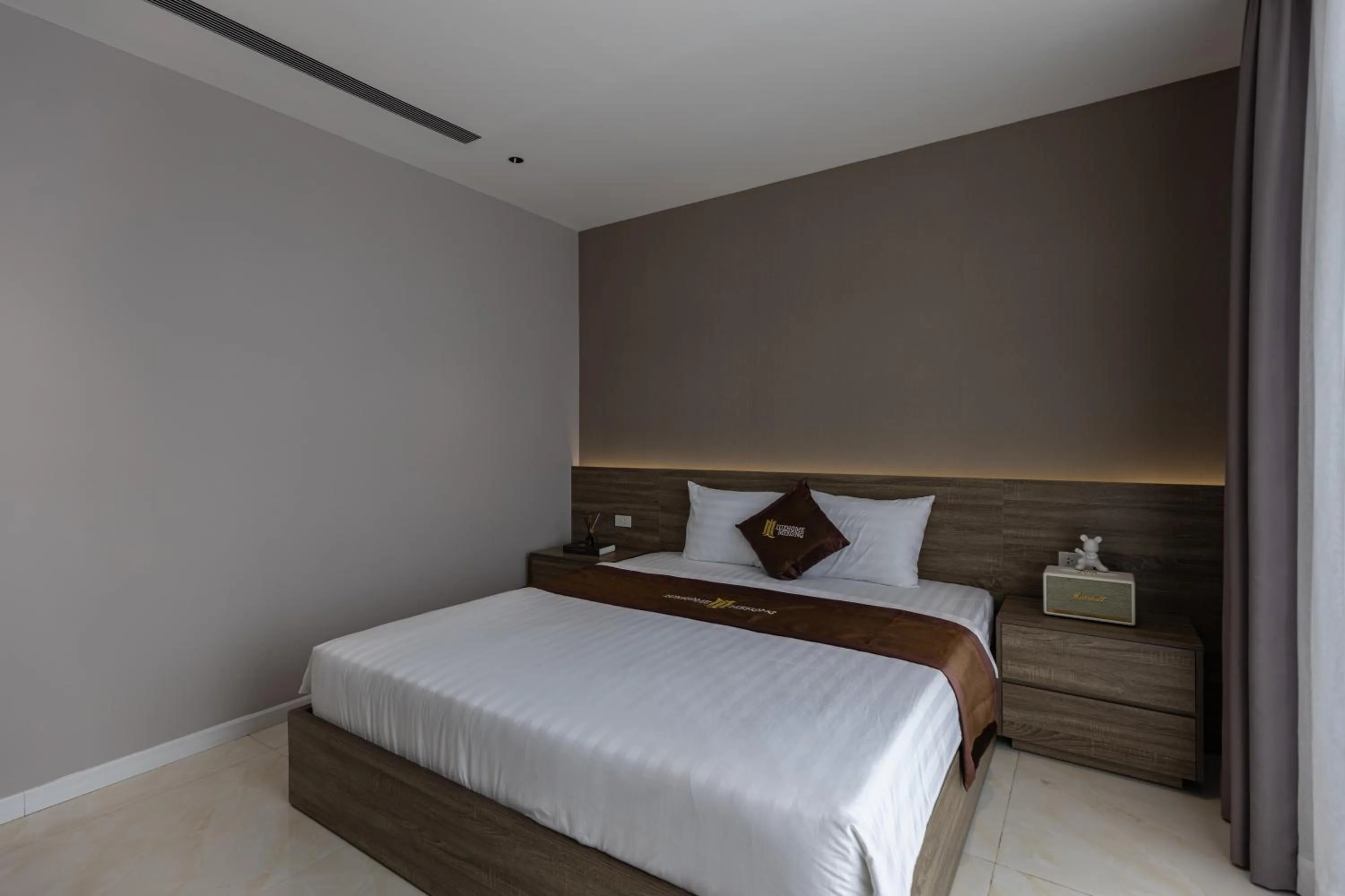 Bed in Luxhome Mekong Hotel