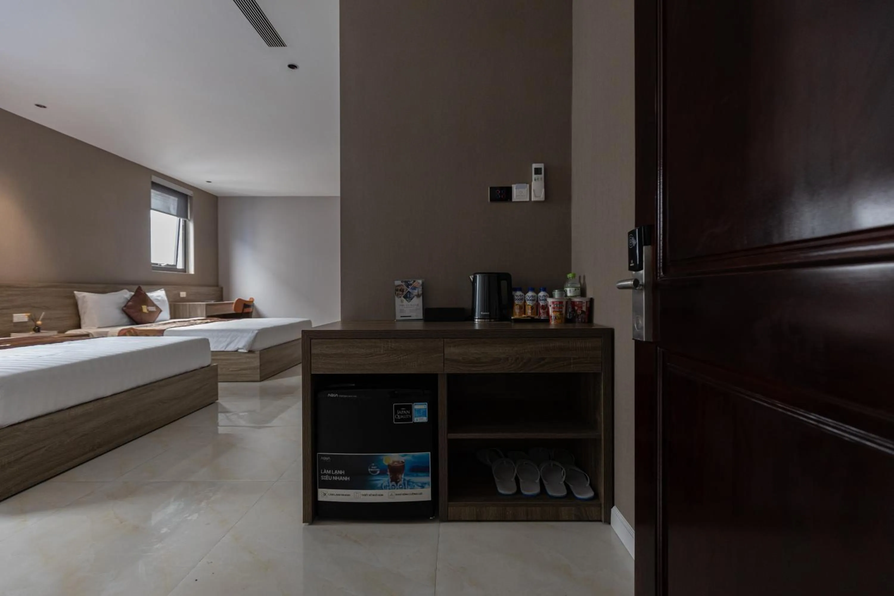 Living room, Bed in Luxhome Mekong Hotel